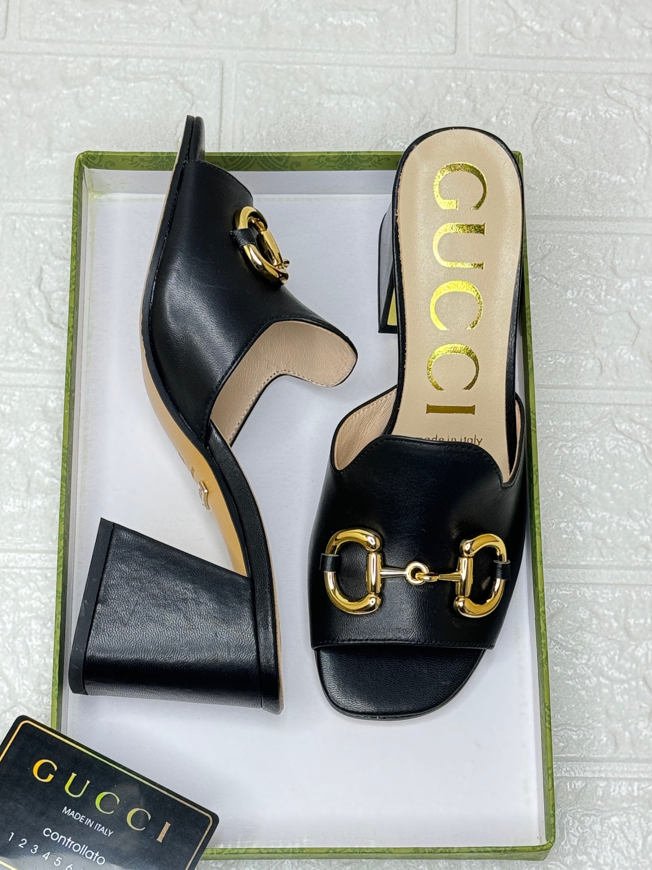 Gucci slide sandals with gold-tone Horsebit hardware and block heels. image 1