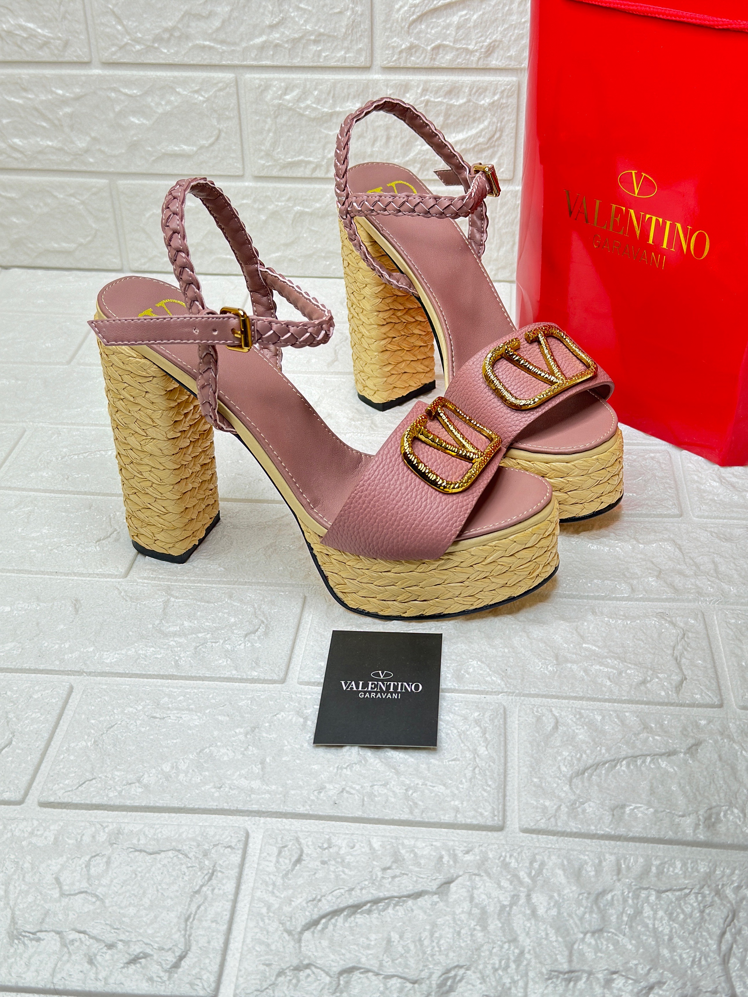 Valentino Garavani VLogo Signature platform sandals with a pink upper and a raffia-covered wedge heel. image 1