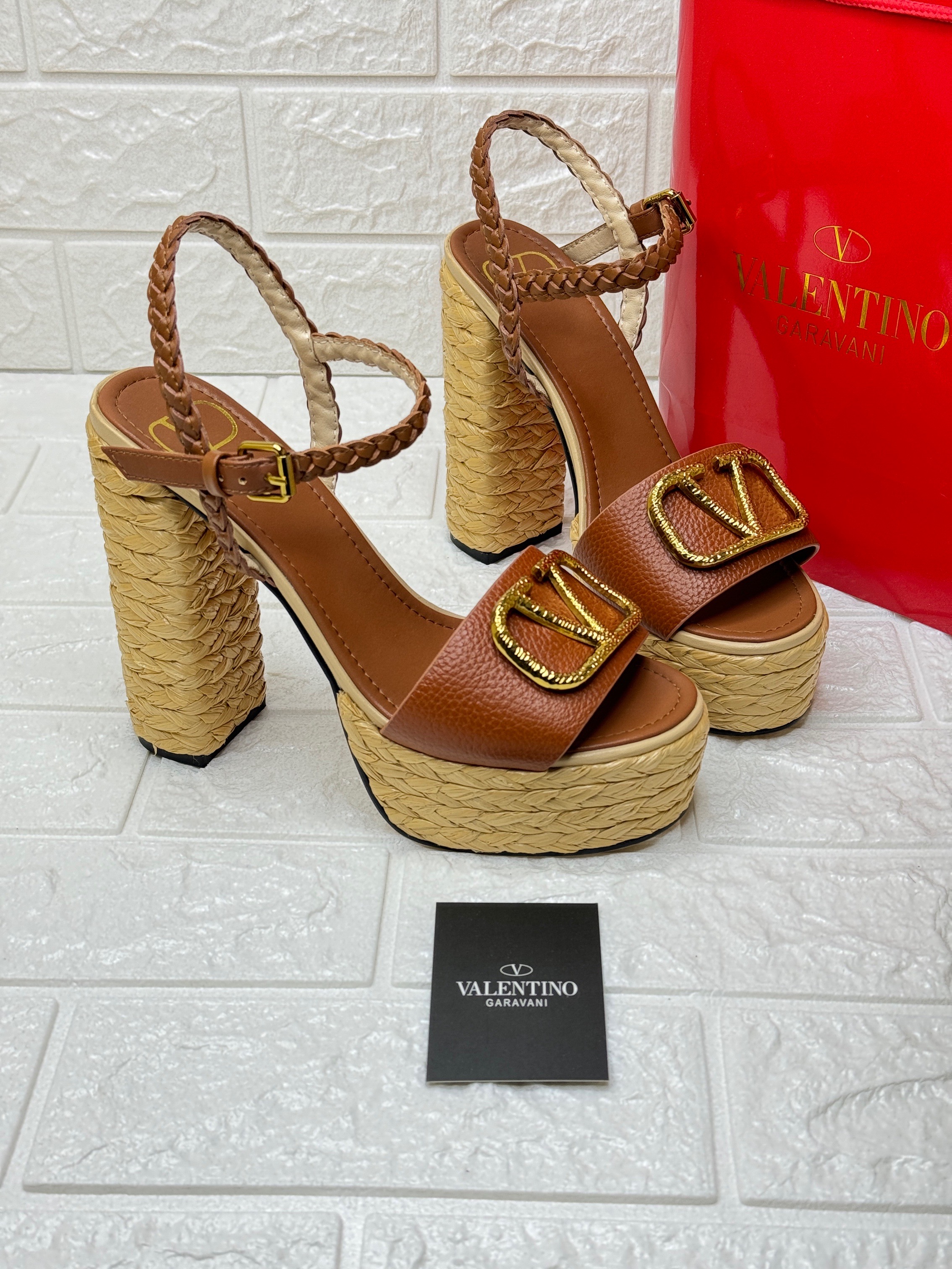 Valentino Garavani VLogo Signature platform sandals with a woven/espadrille-style heel and platform in a reddish-brown leather. image 1