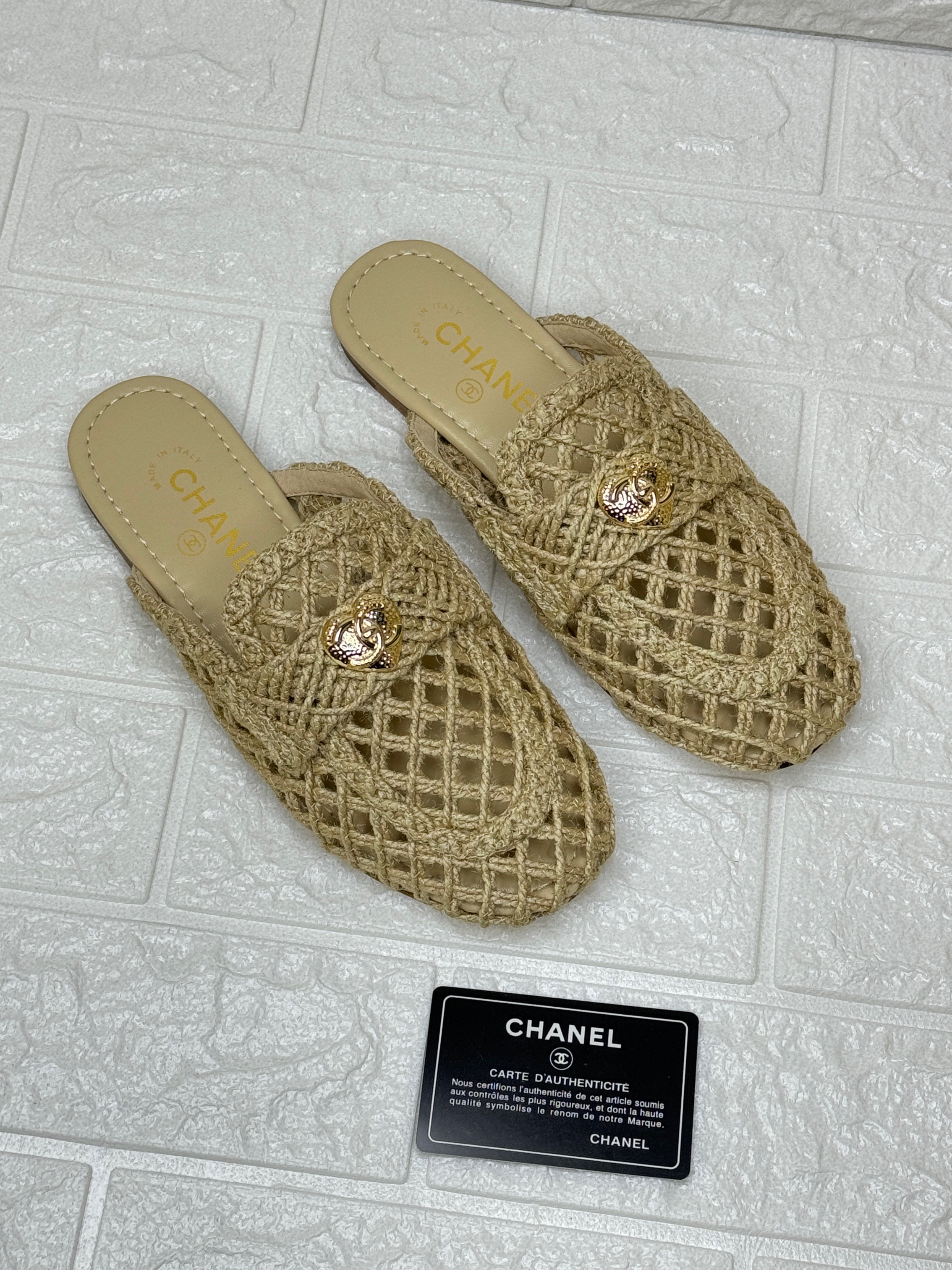 Chanel woven net mules with a small gold-tone CC logo. image 1