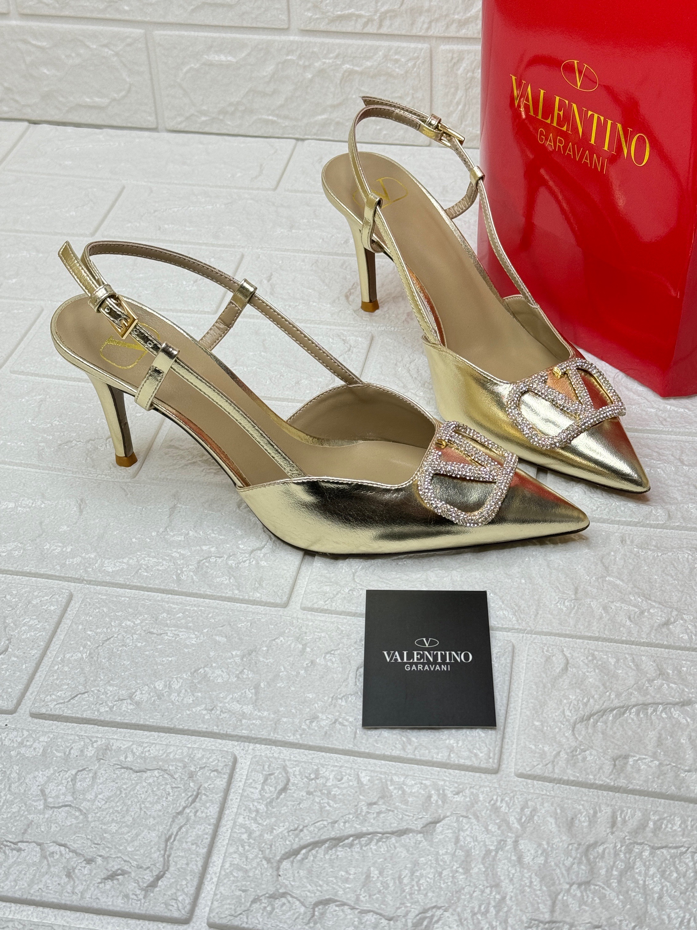 Valentino Garavani VLogo Signature metallic slingback pumps with crystal embellishments. image 1
