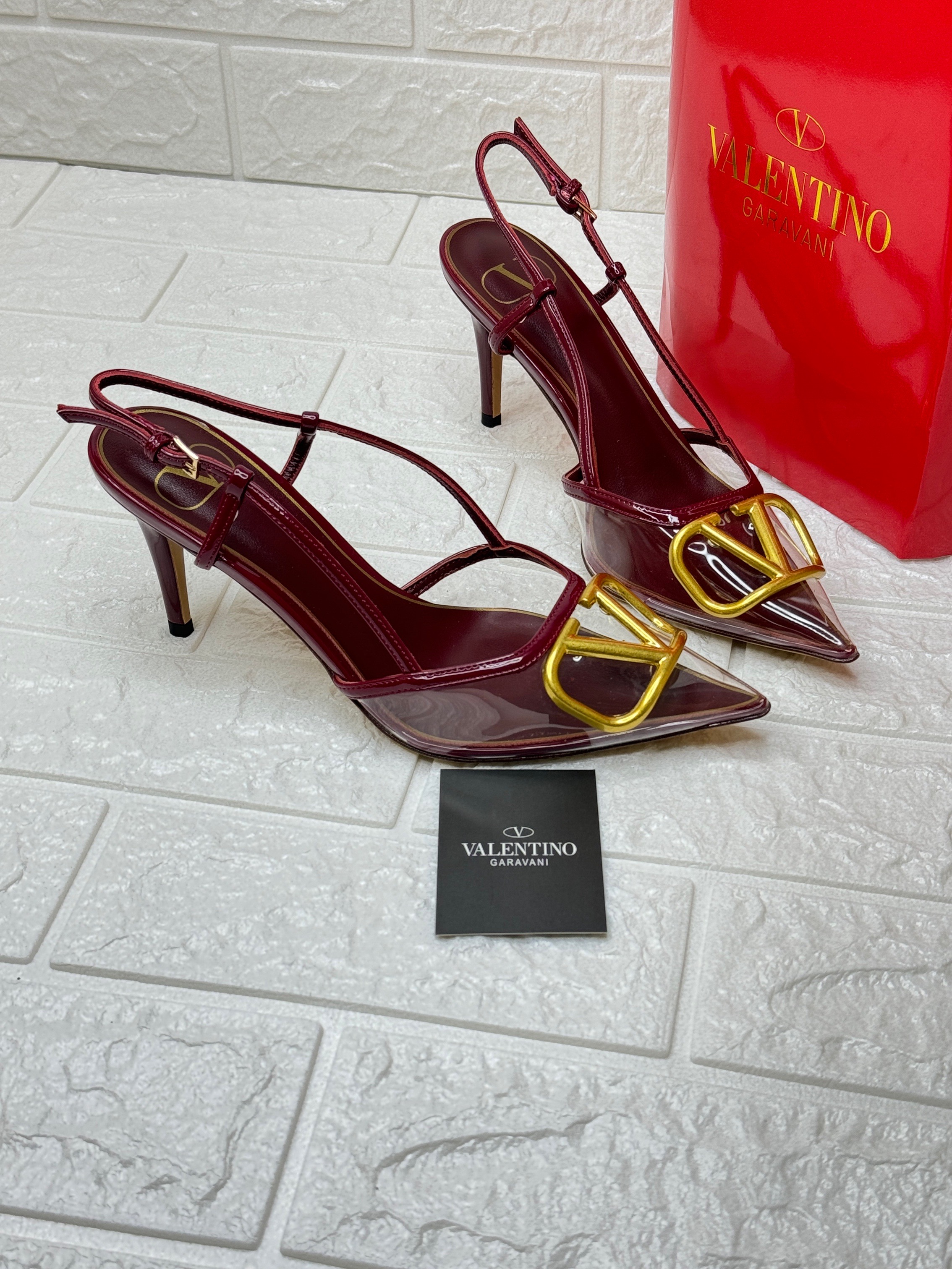 Valentino Garavani VLogo Signature slingback pumps in a red patent leather finish. image 1