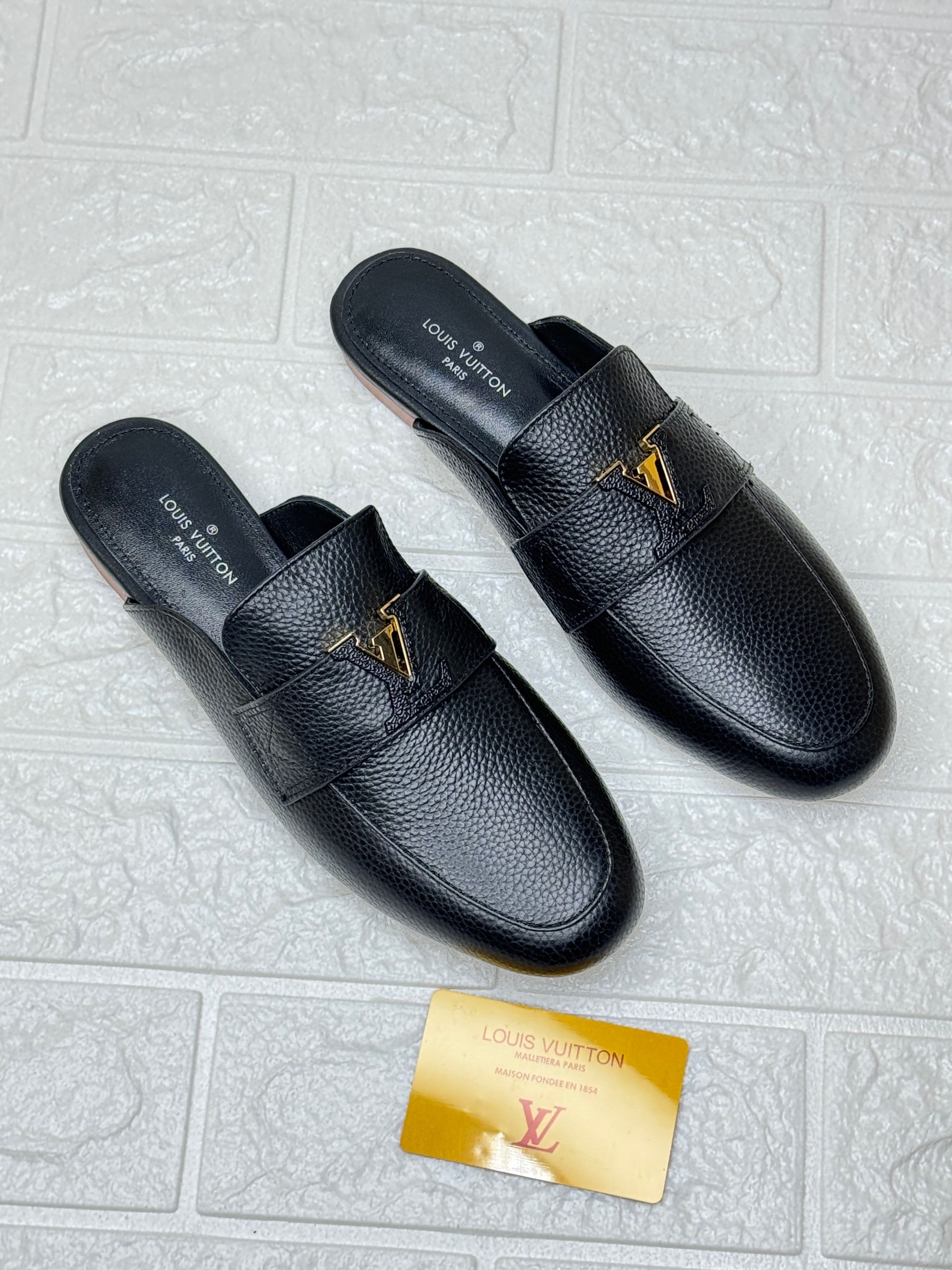 Louis Vuitton LV Mare Open Back Loafers in black grained calf leather. image 1