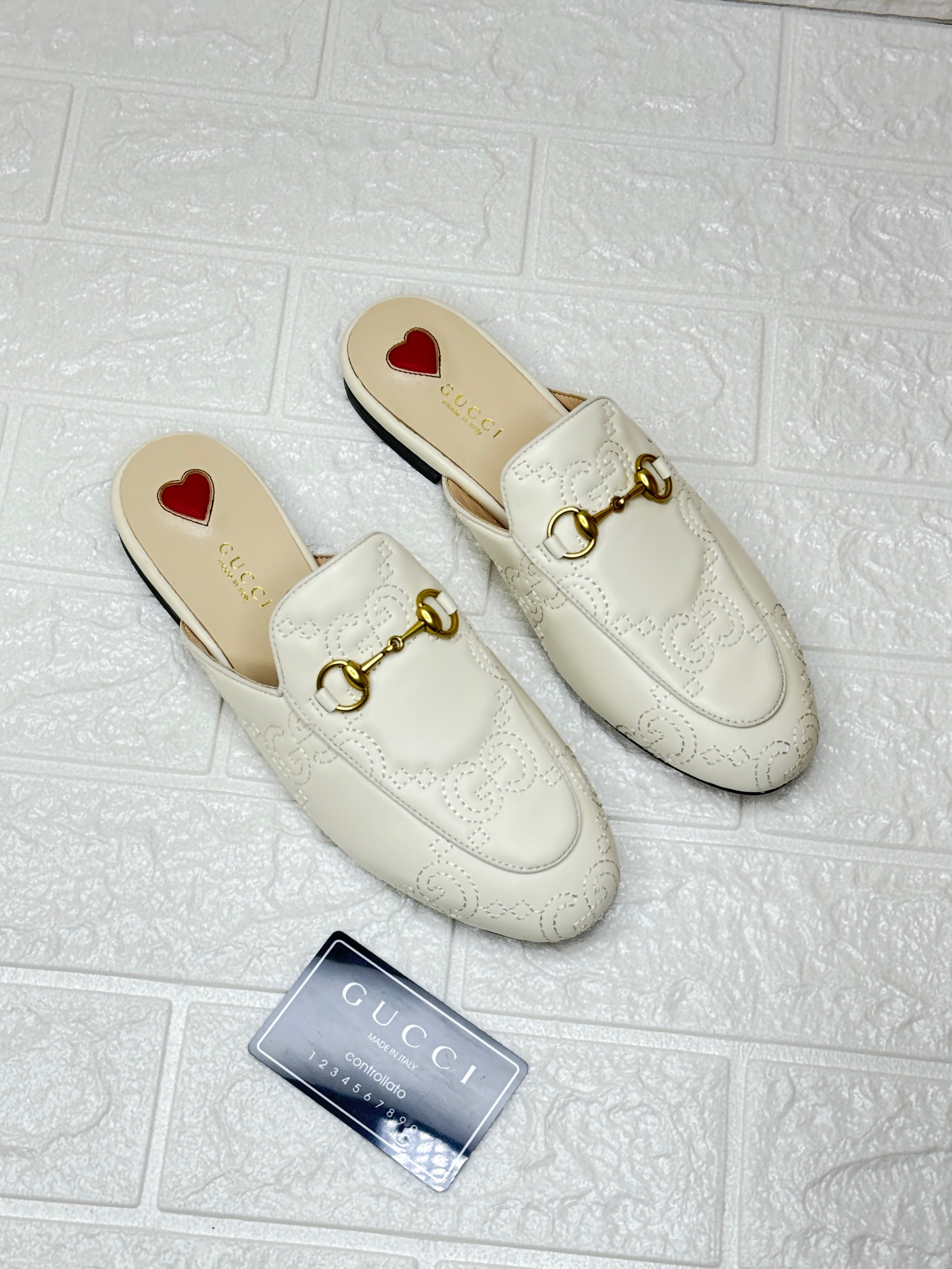 Gucci Princetown leather slippers with a gold-tone horsebit detail and heart motif on the insole. image 1