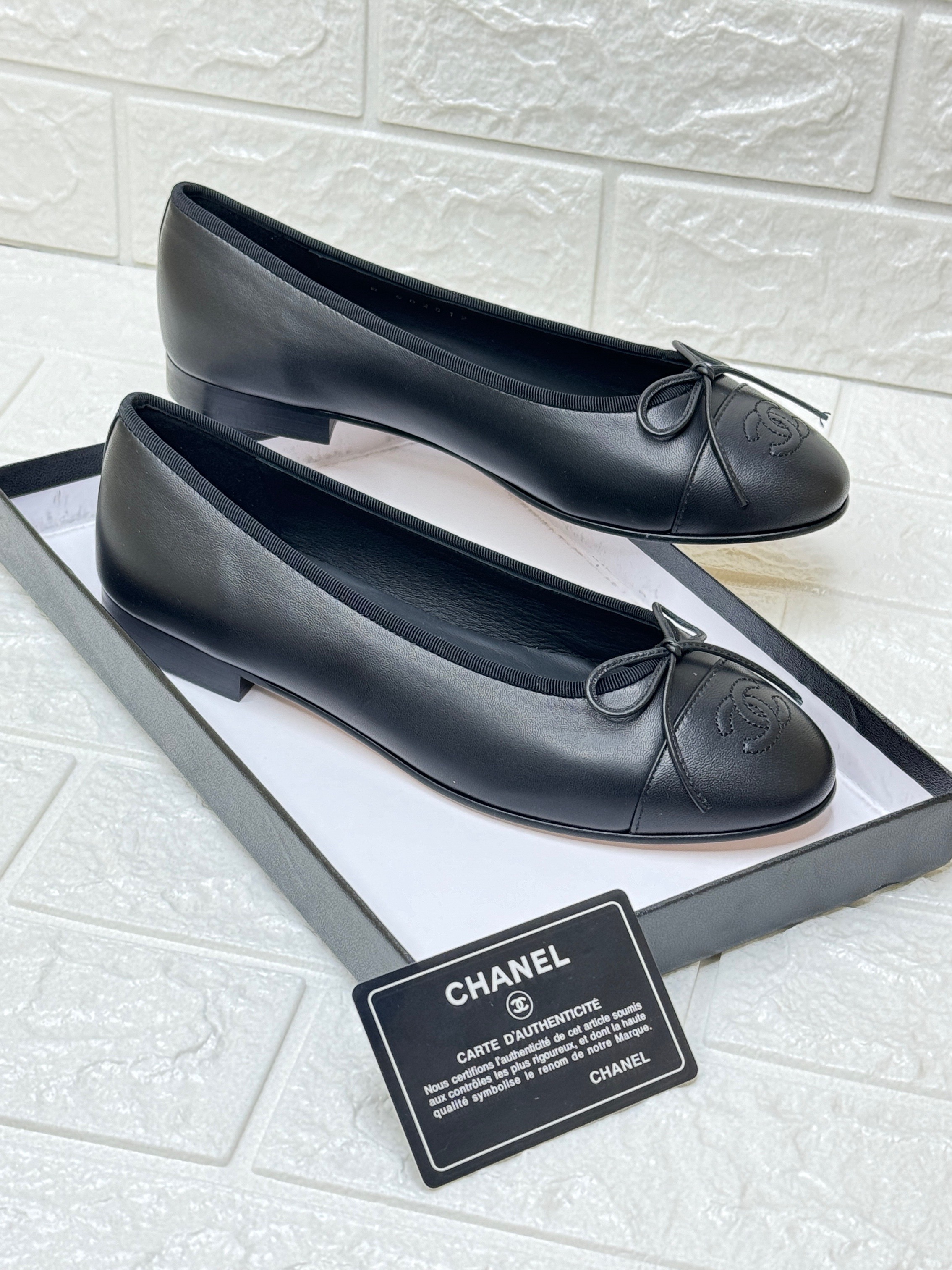 Chanel black leather CC cap toe bow ballet flats. image 1