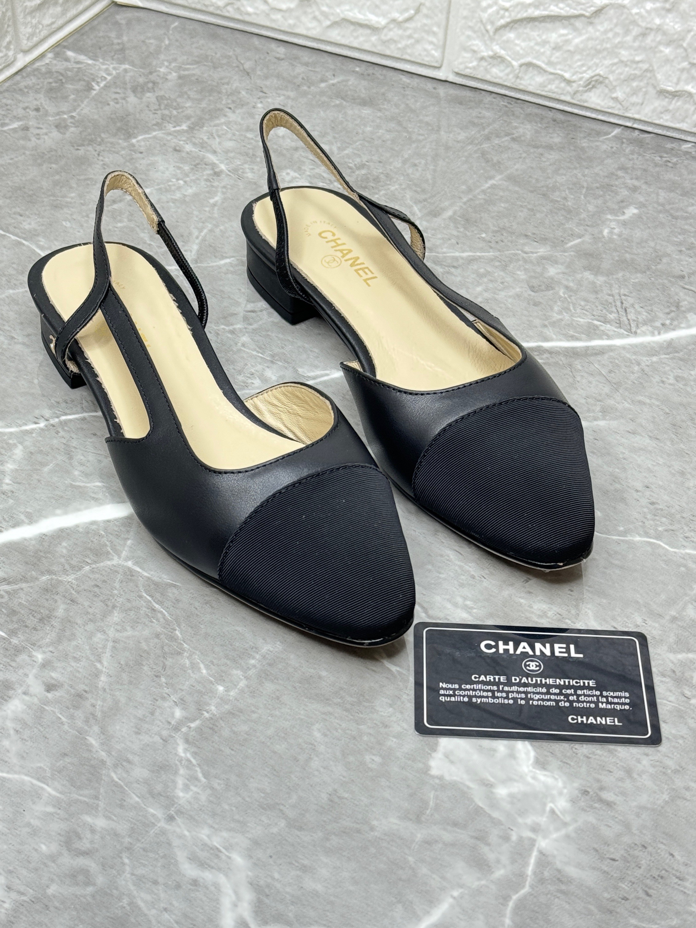 Chanel black leather and canvas CC cap toe slingback flats. image 1