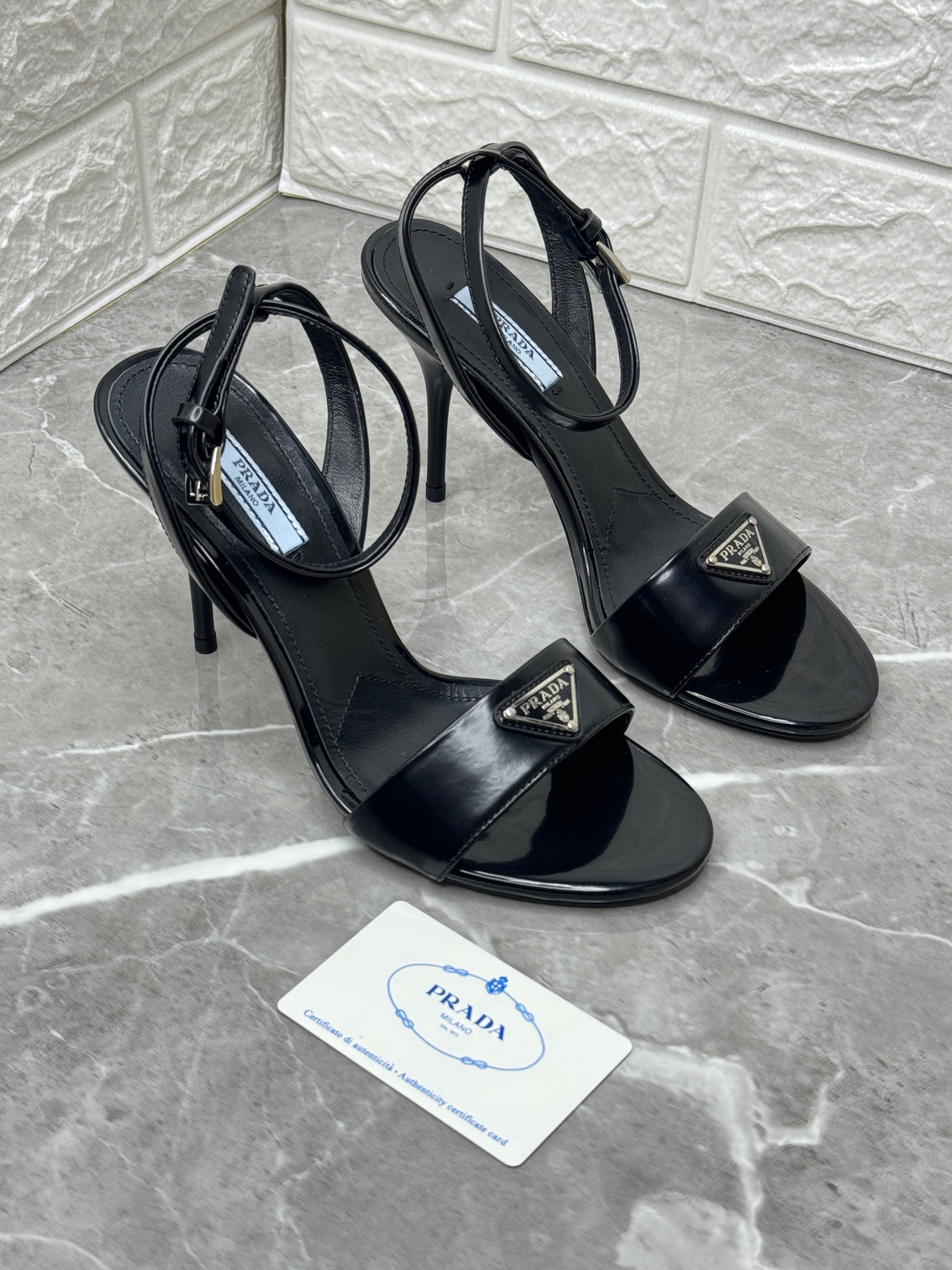 Prada brushed leather sandals with ankle straps and a 100 mm varnished heel. image 1