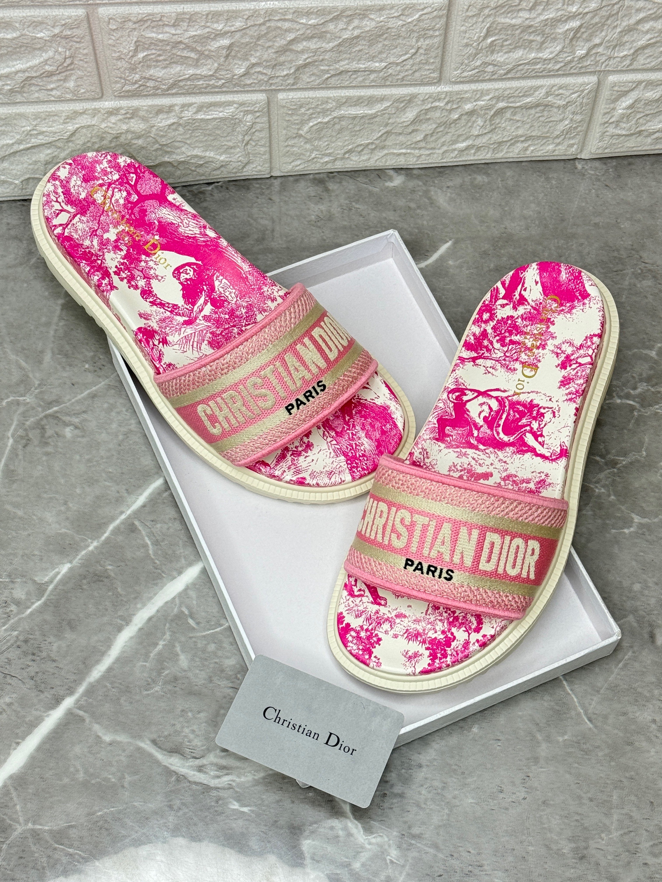 Christian Dior Dway slides in bright pink embroidered cotton with a Rose des Vents pink Millefiori motif, featuring the "Christian Dior Paris" signature on the upper strap. image 1