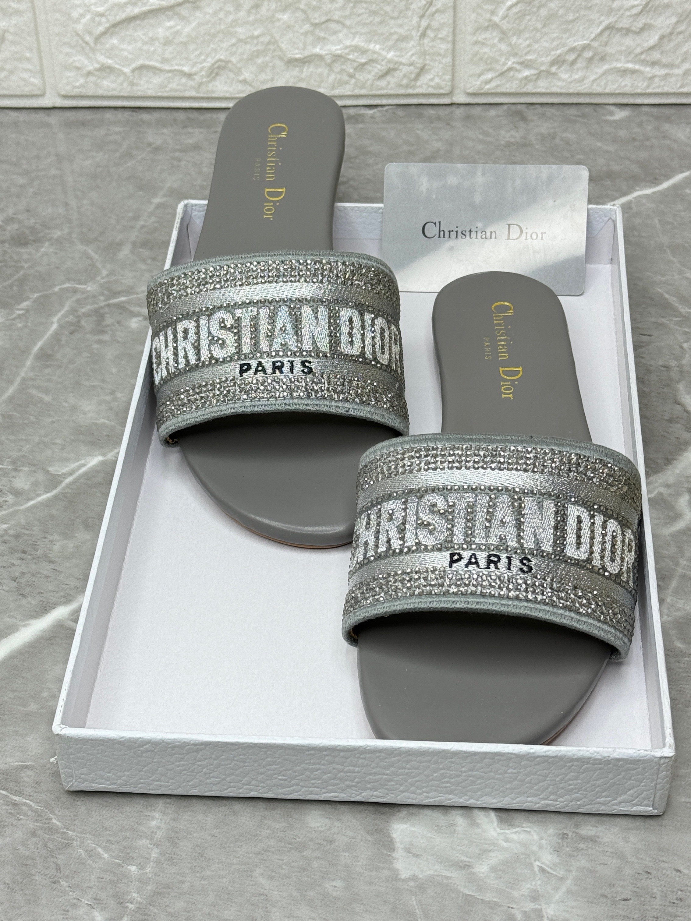 Dior Dway flat slide sandals in grey canvas with a Christian Dior Paris embroidered signature. image 1