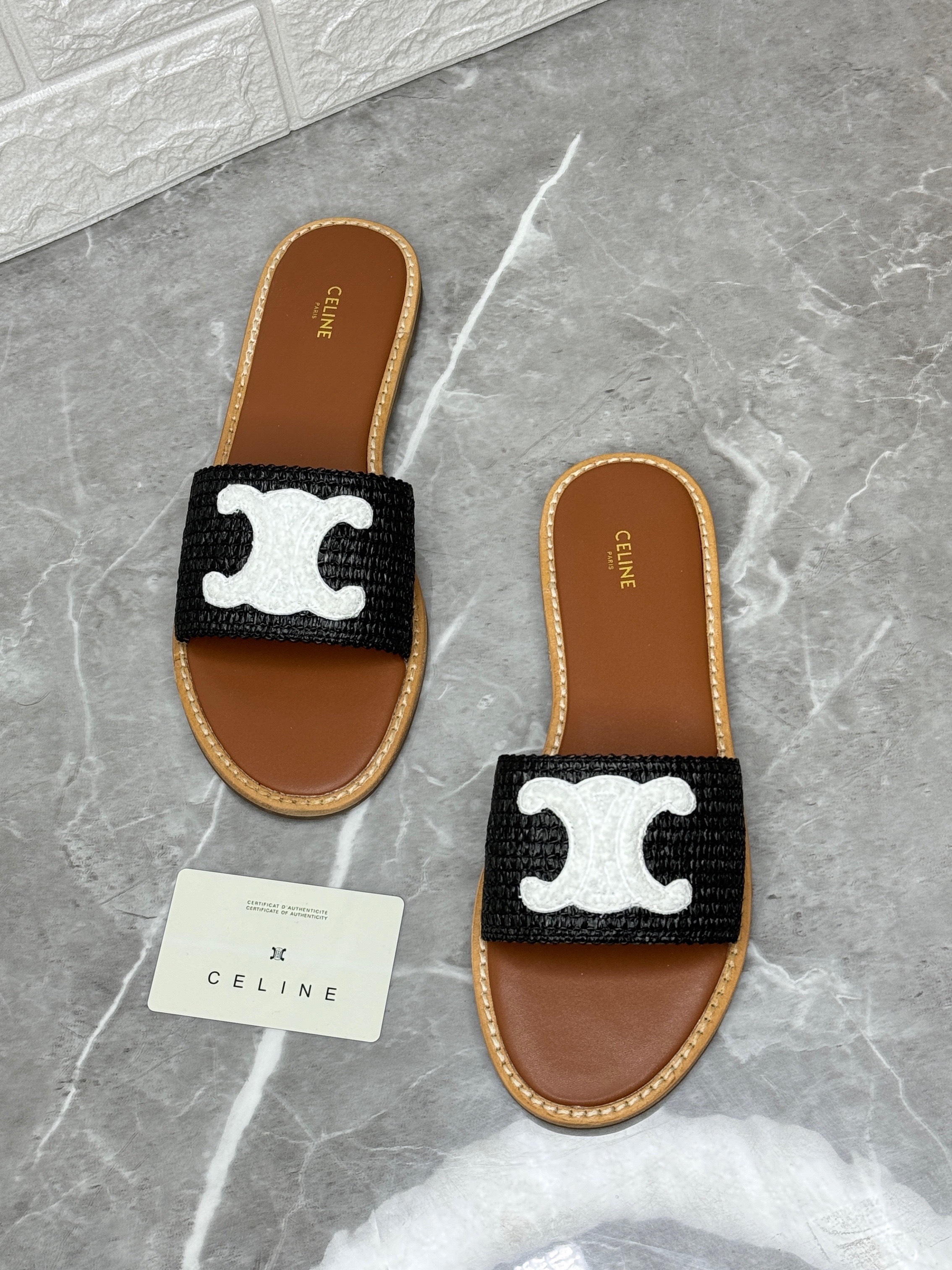 Celine women's black logo slippers with a brown sole. image 1