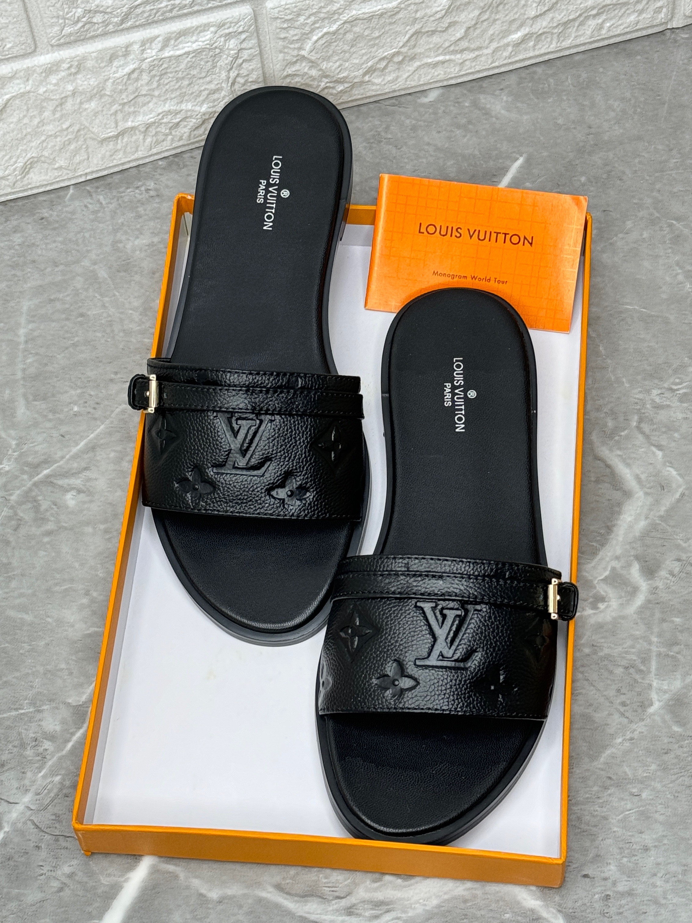 Louis Vuitton women's black leather flat slippers. image 1