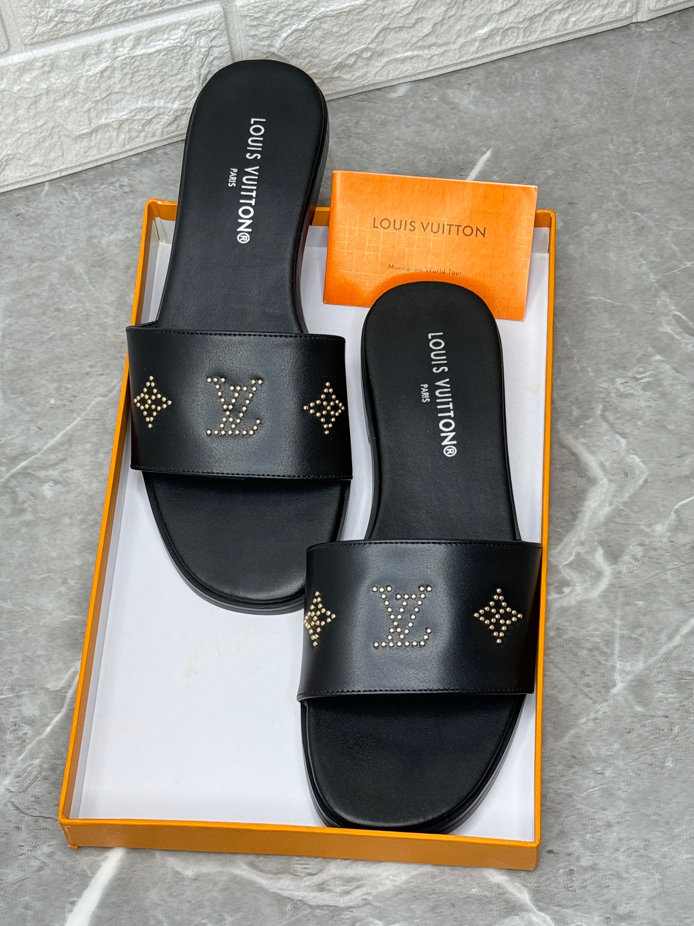 Louis Vuitton LV Frame mule in black leather with stud details. image 1