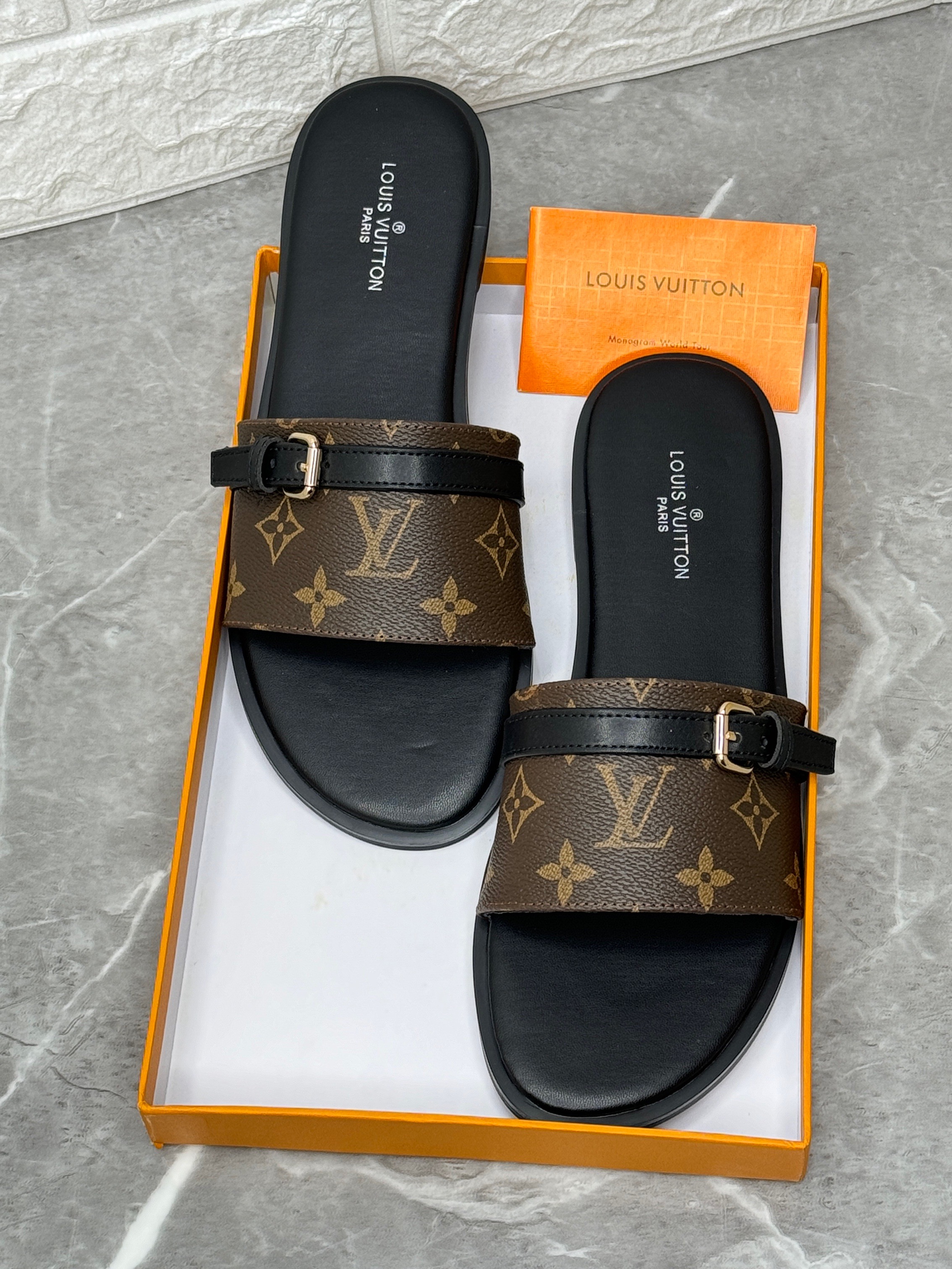 Louis Vuitton Lock It flat slide sandals in brown Monogram canvas. image 1
