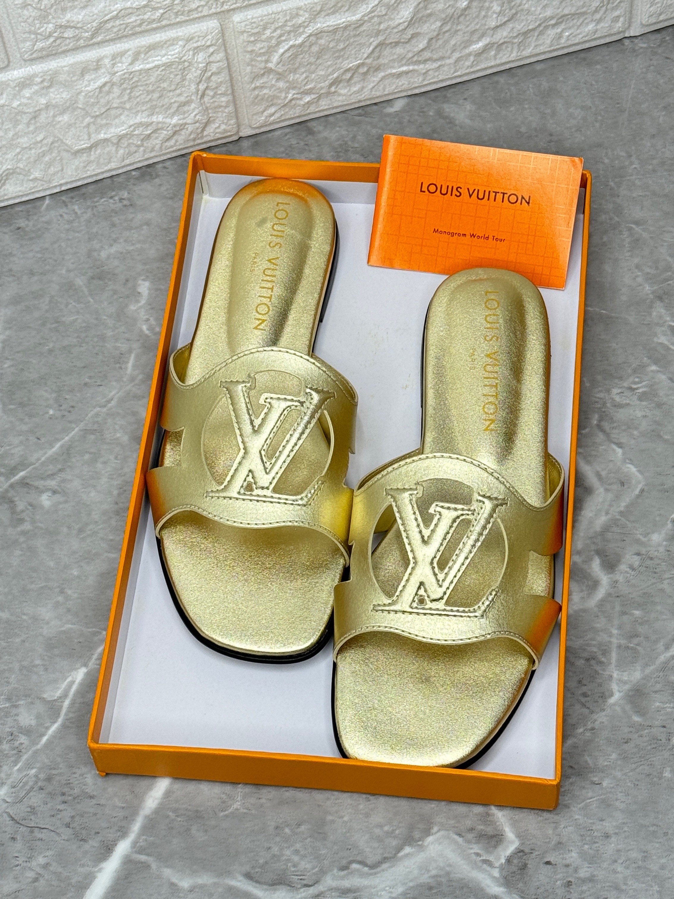 Louis Vuitton LV Isola flat mule in metallic gold lambskin. image 1