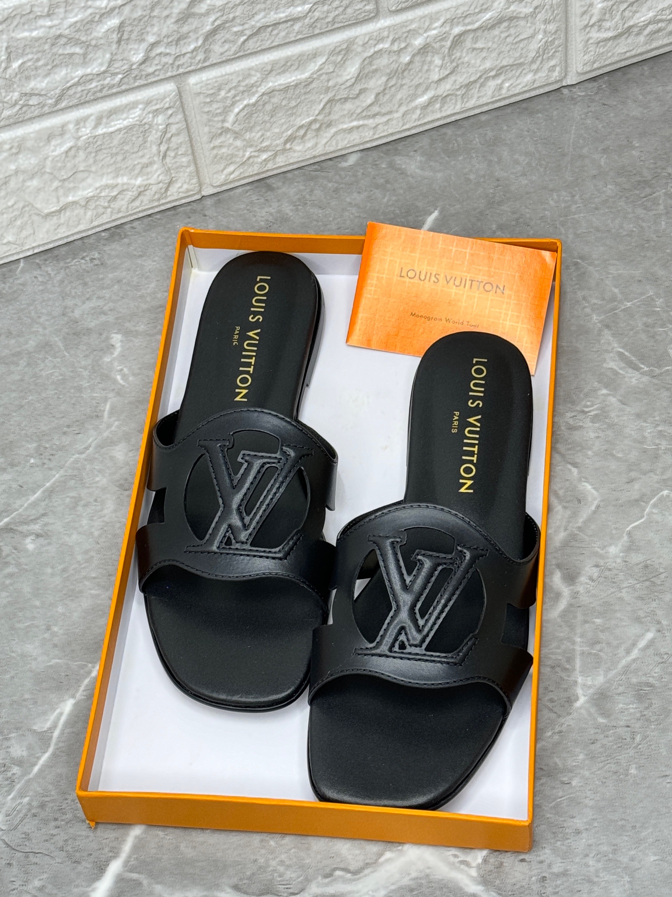 Louis Vuitton LV Isola flat mule in black calf leather. image 1
