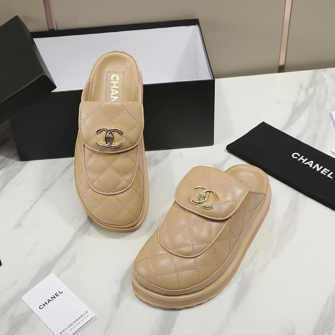 Chanel platform mules in a beige quilted leather with a prominent CC logo on the vamp. image 1
