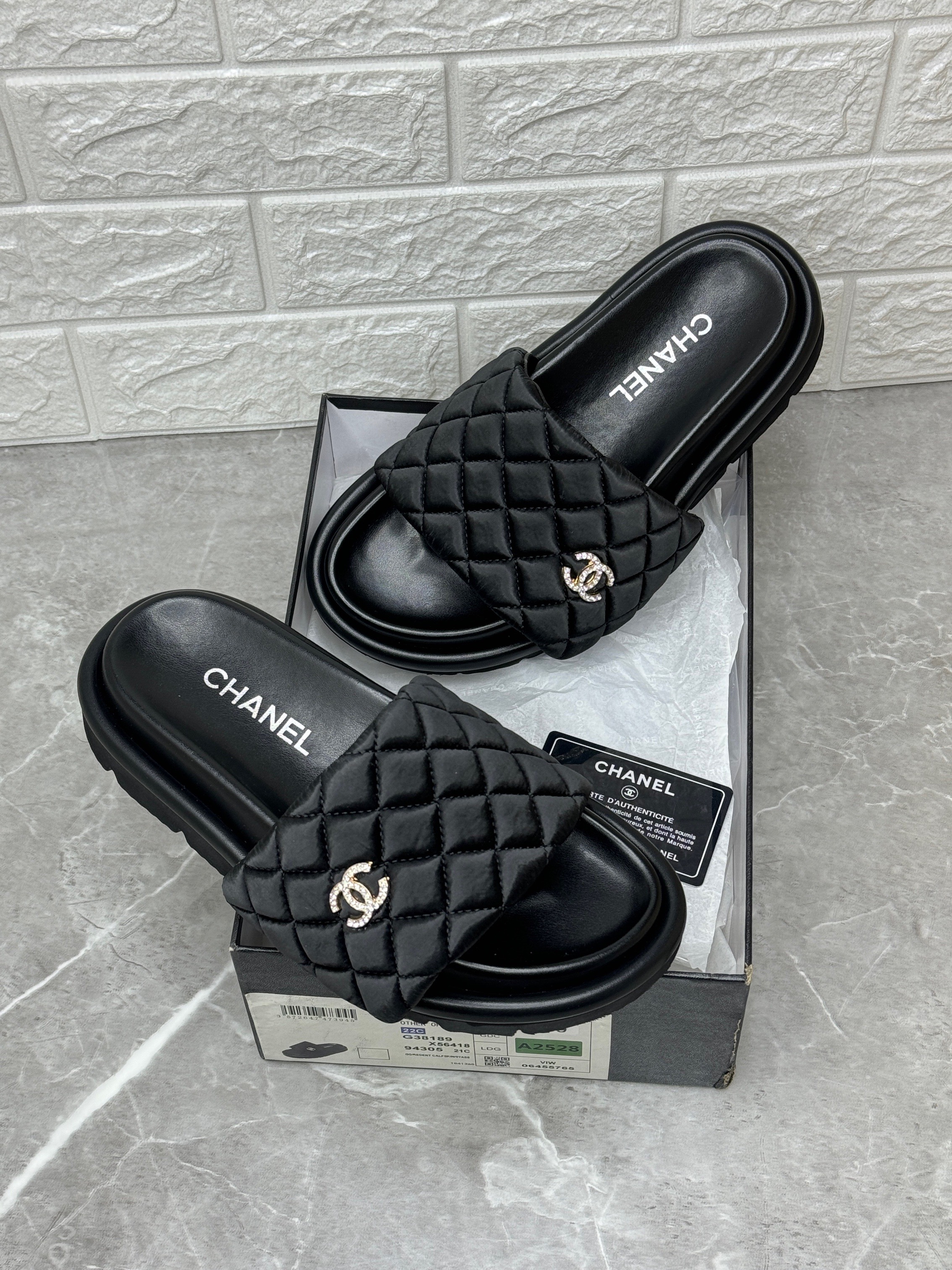 Chanel black quilted neoprene CC slide sandals. image 1