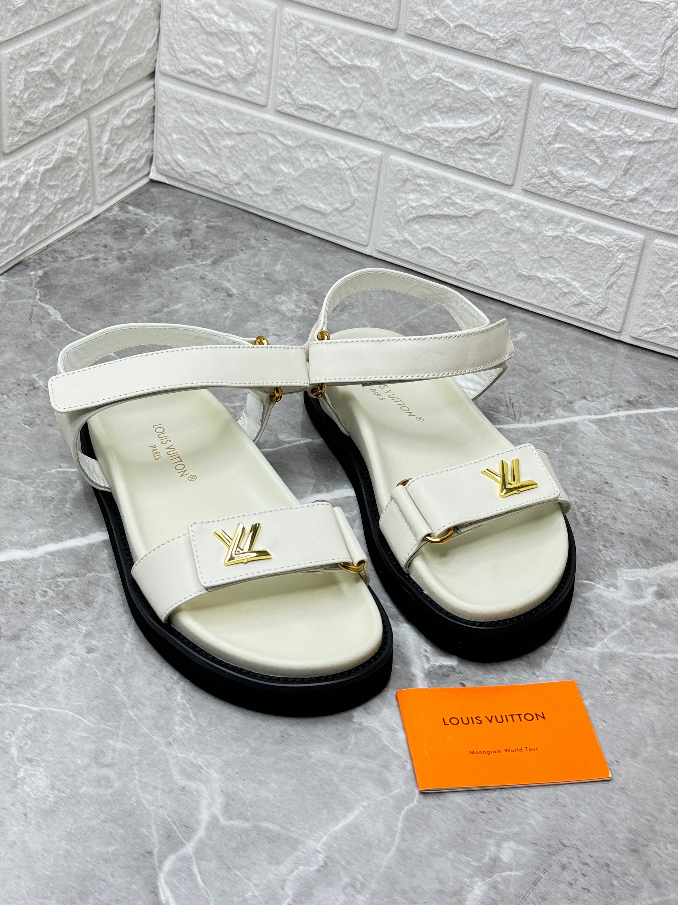 Louis Vuitton LV Sunset Flat Comfort Sandal in white calf leather. image 1