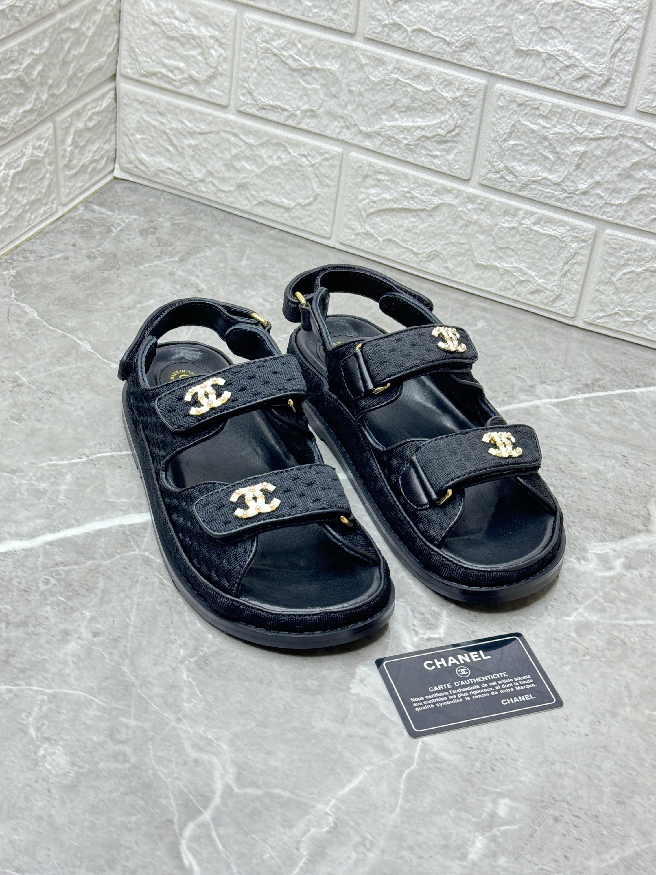 Chanel black quilted fabric dad sandals with velcro straps and CC logo detailing. image 1