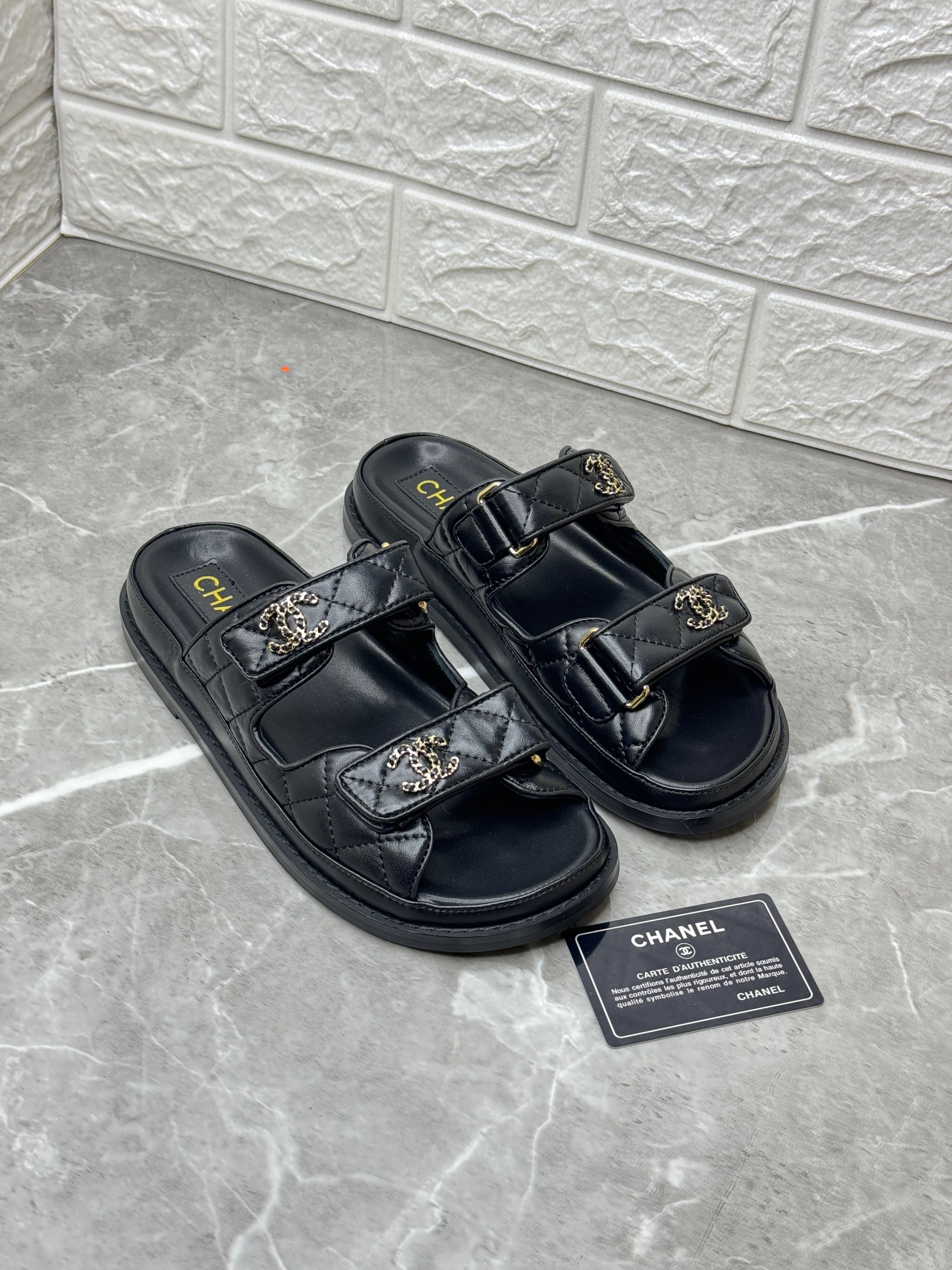 Chanel quilted lambskin leather dad sandals with adjustable Velcro straps and gold CC chain detailing. image 1