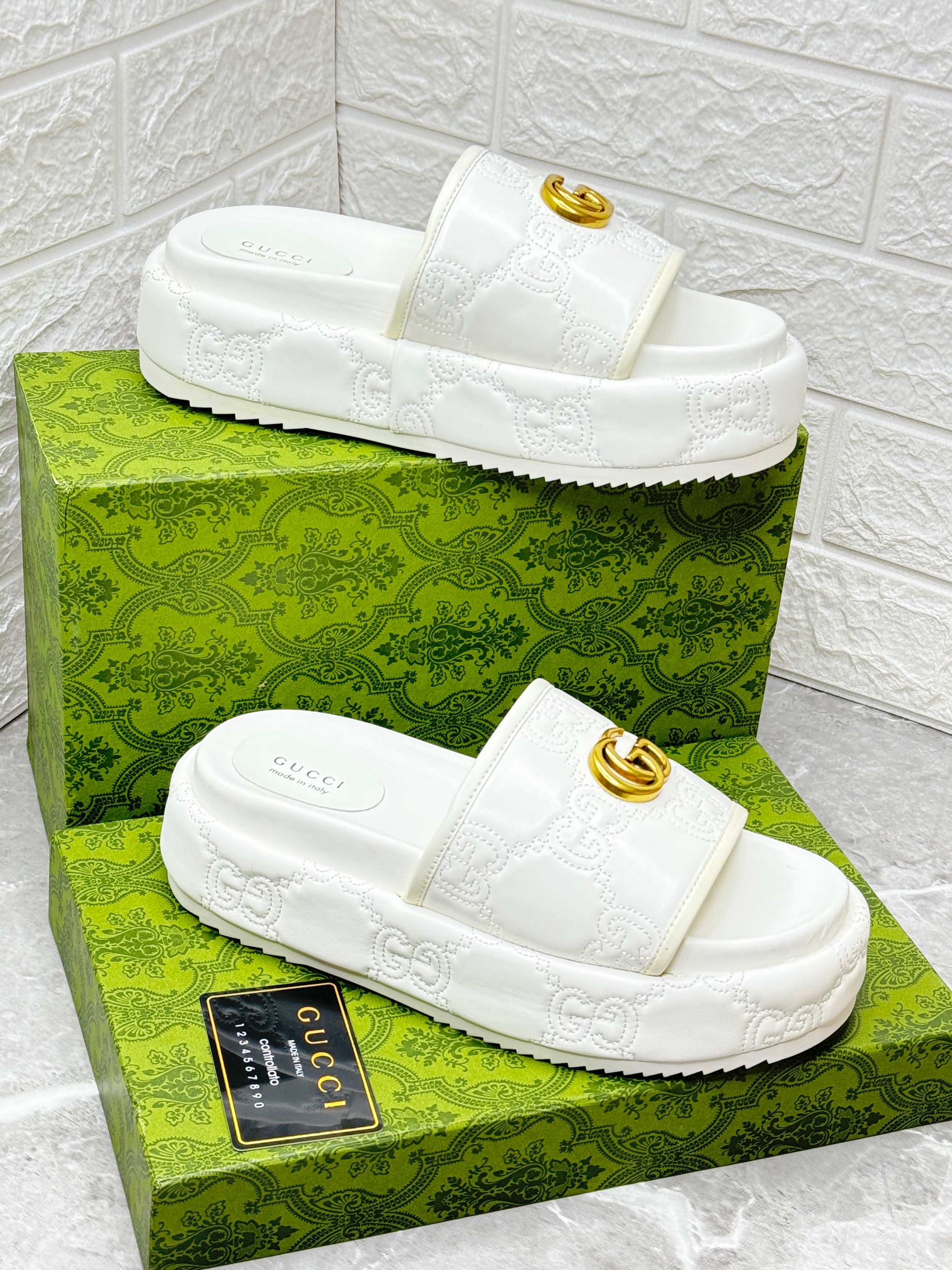 Gucci Interlocking G slide sandals in a pink and mauve rubber with a platform sole. image 1