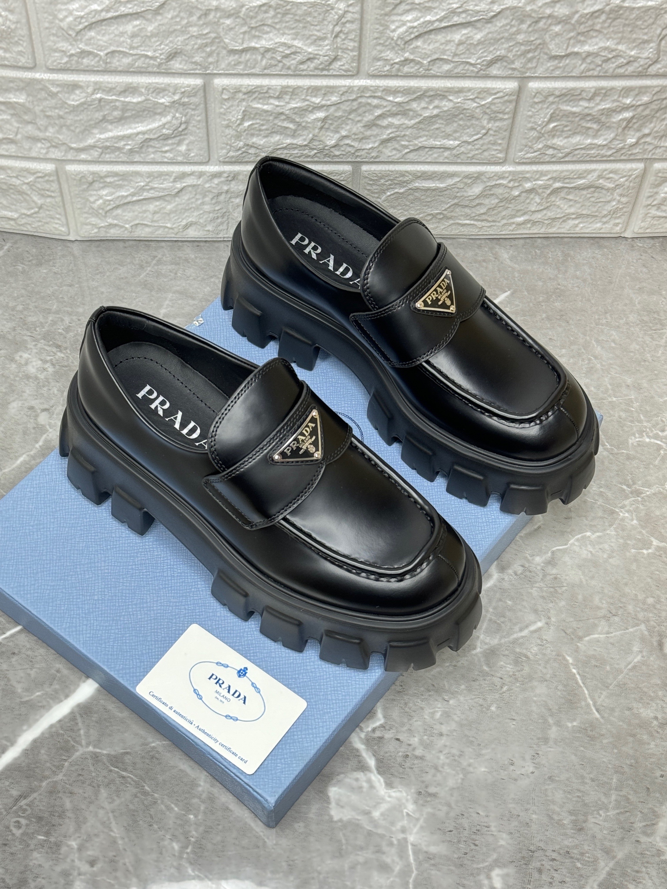 Prada Monolith brushed leather loafers in black. image 1