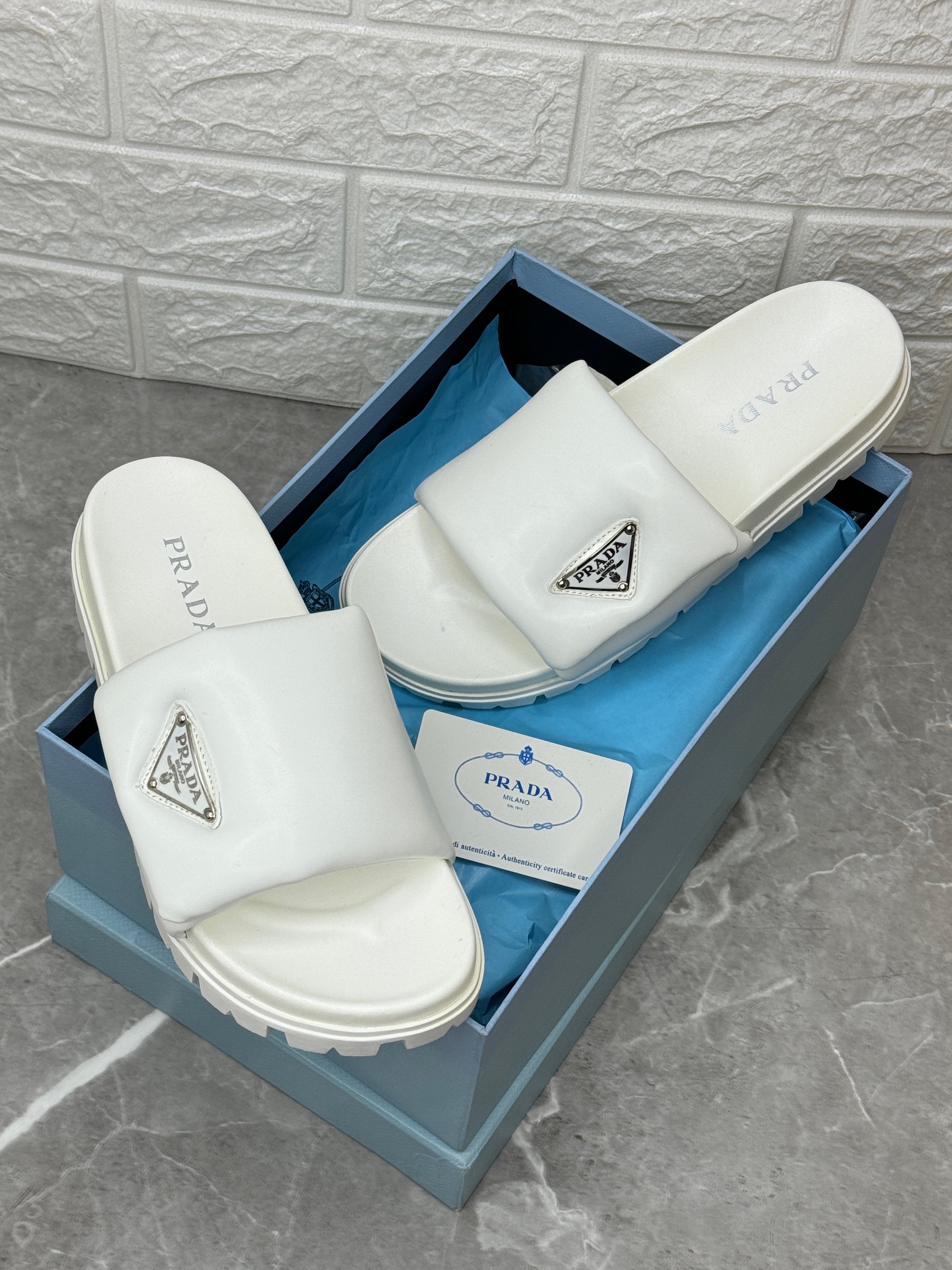 Padded Nappa Leather Slides in white. image 1