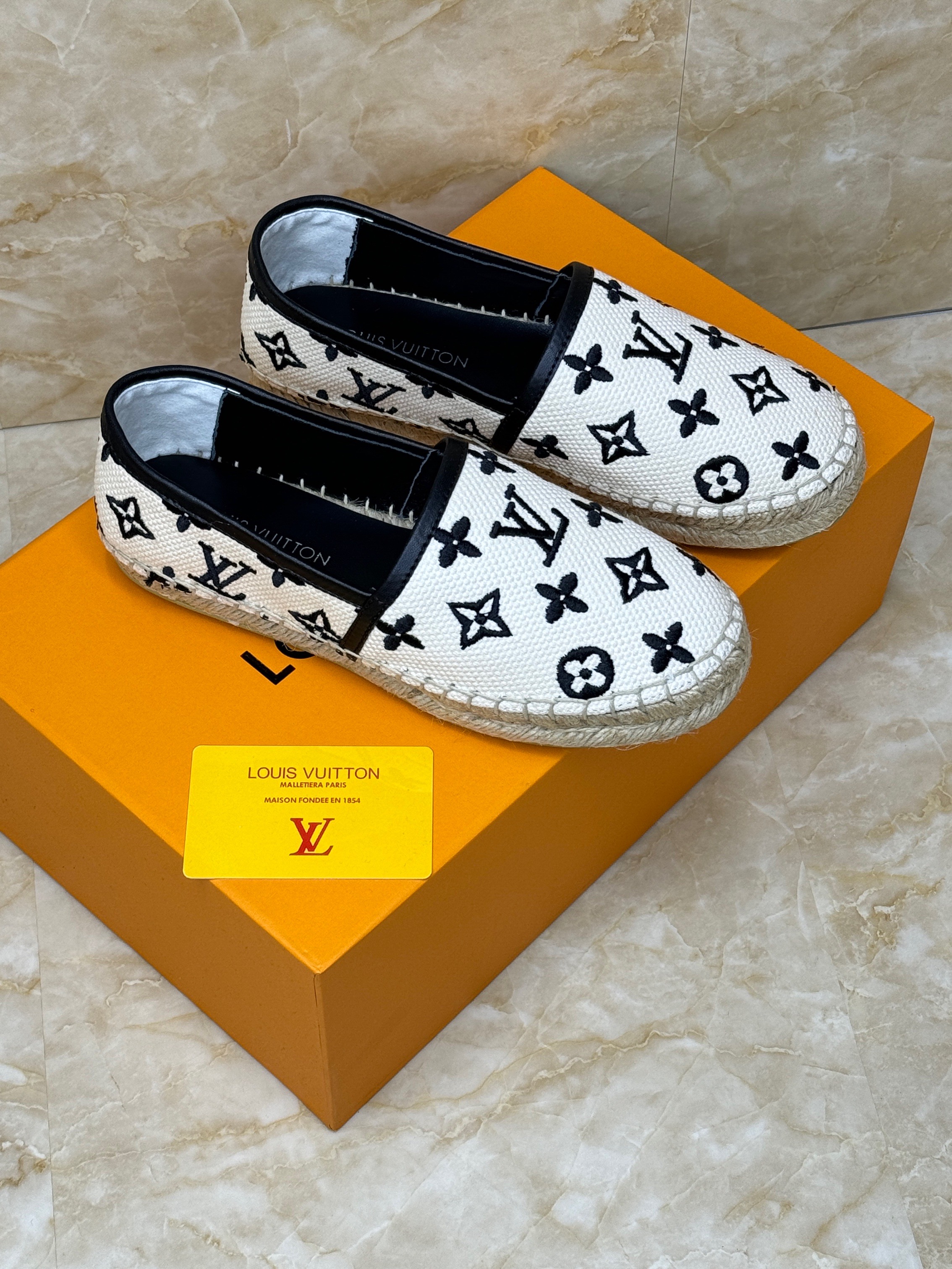 Louis Vuitton Starboard Flat Espadrille shoe with a beige and black monogram. image 1