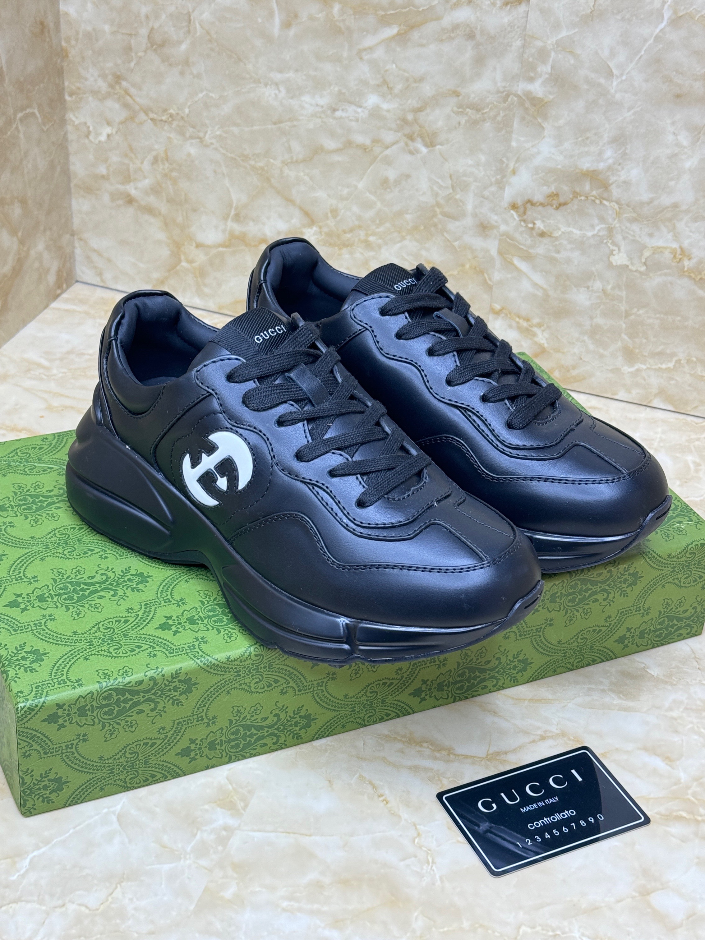 Gucci Rhyton sneakers in black leather. image 1