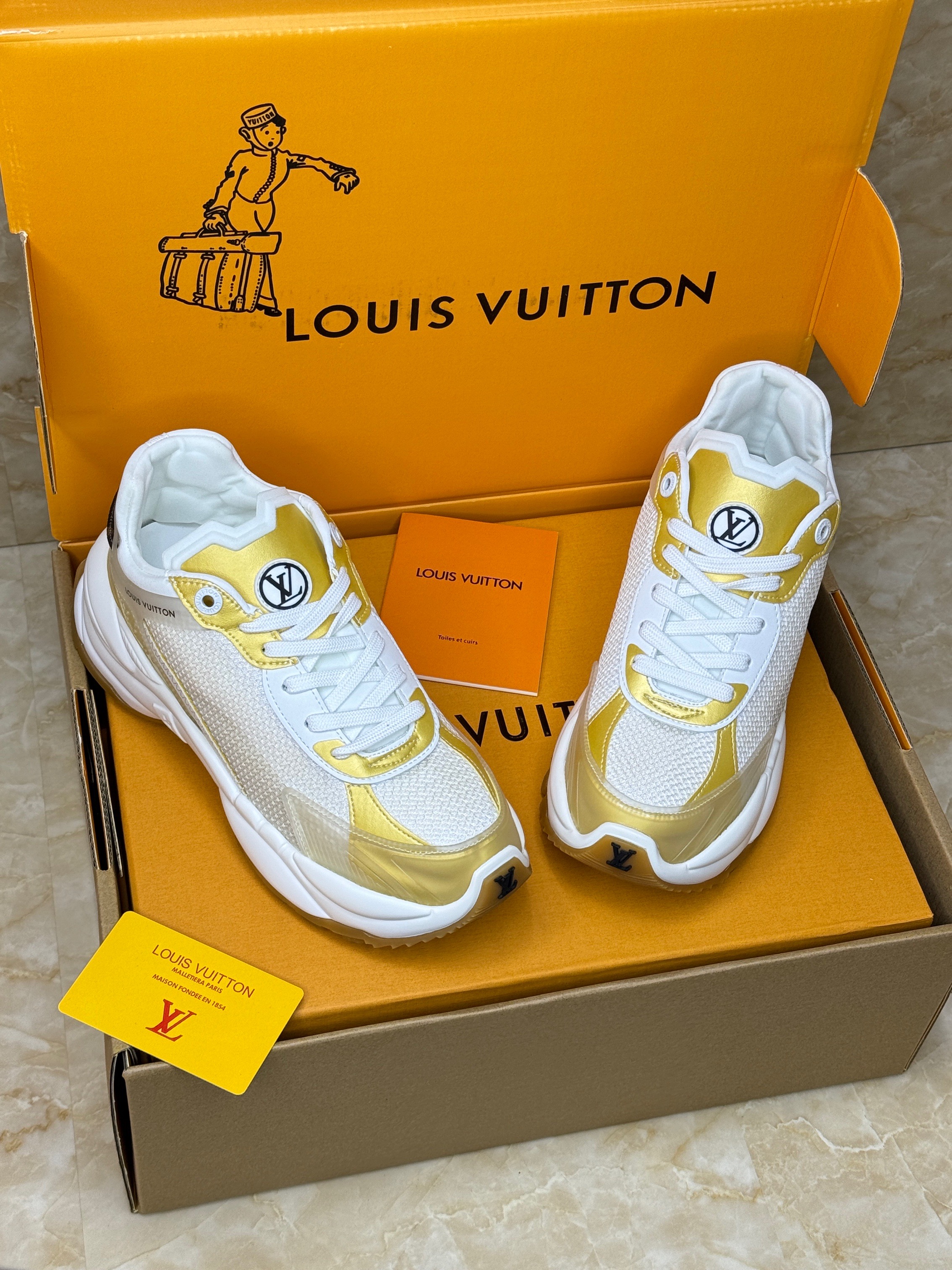 Louis Vuitton Run 55 sneaker in white and gold technical mesh and leather. image 1