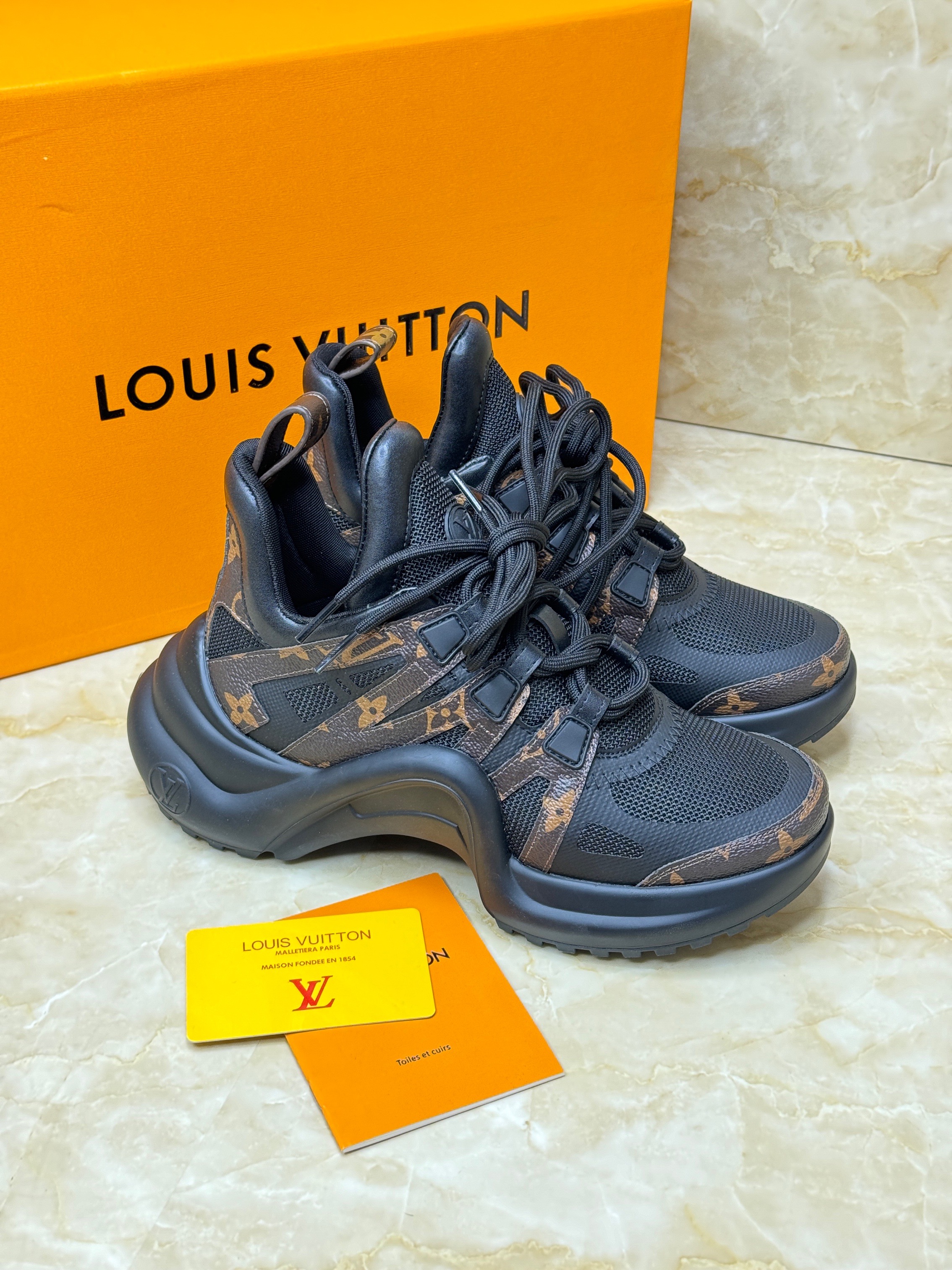Louis Vuitton Archlight sneakers in black mesh and monogram canvas with a wave-shaped rubber outsole. image 1