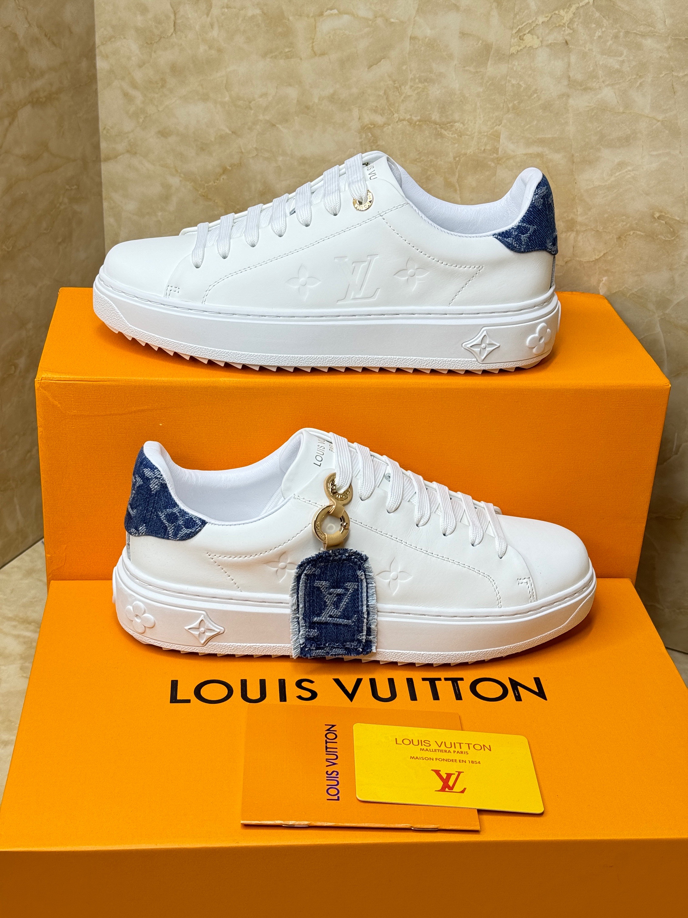 Louis Vuitton Time Out sneaker in white calf leather with Monogram canvas trim at the back. image 1