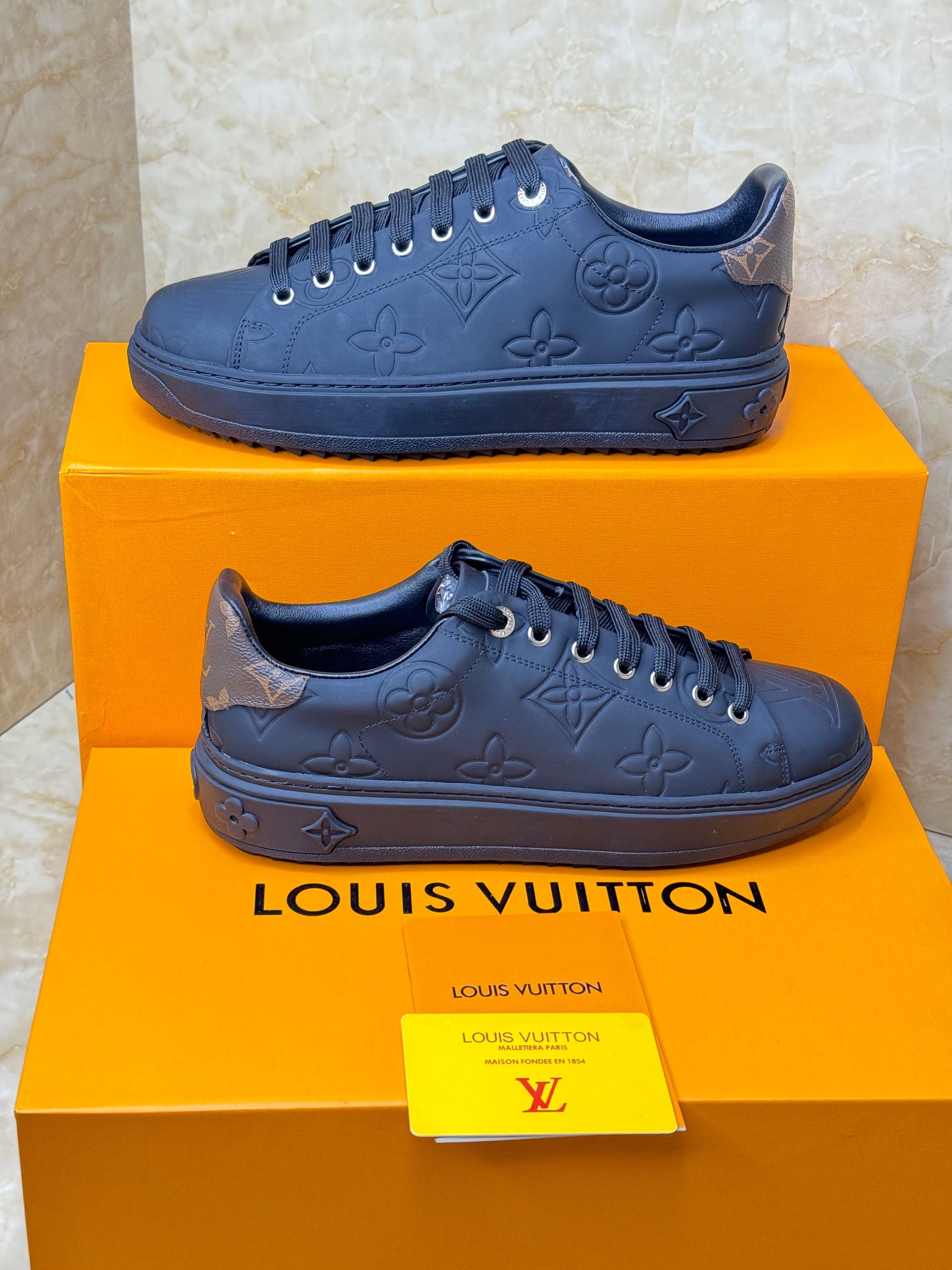 Louis Vuitton Time Out sneakers in debossed black calf leather. image 1