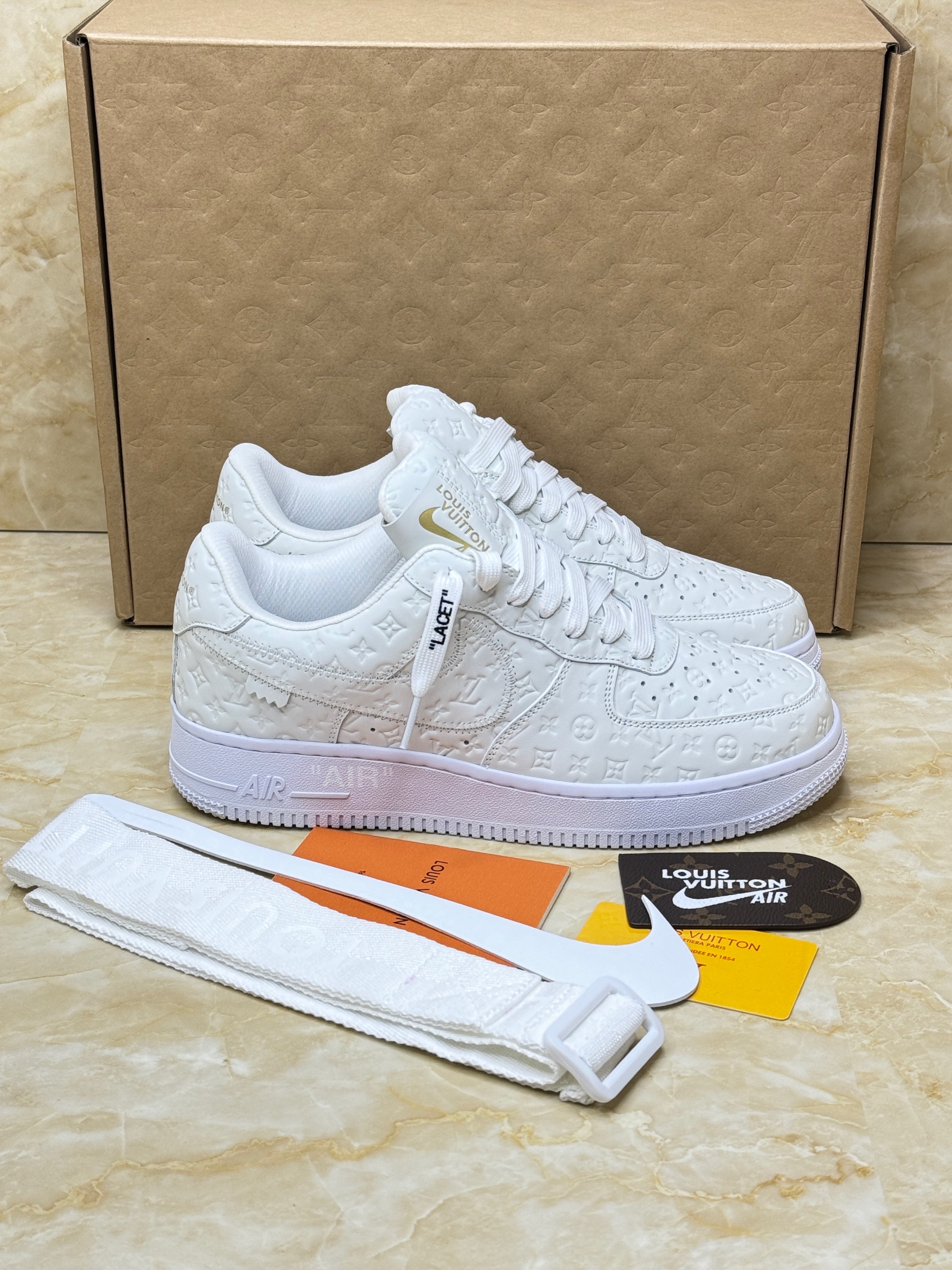 Louis Vuitton Nike Air Force 1 Low By Virgil Abloh in the white colorway with an embossed monogram pattern. image 1