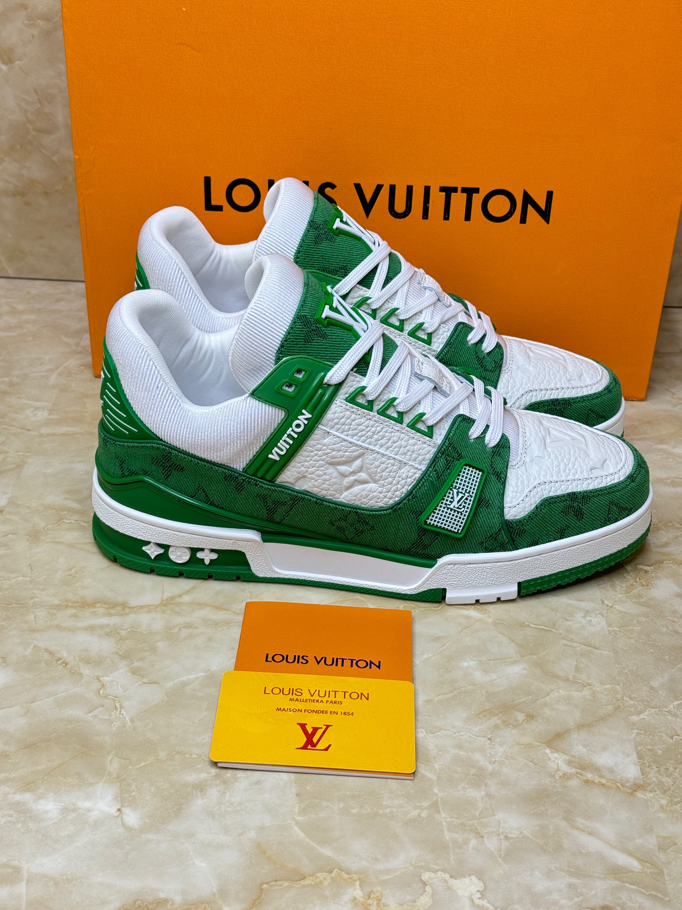 Louis Vuitton Trainer sneaker in green monogram denim and white. image 1