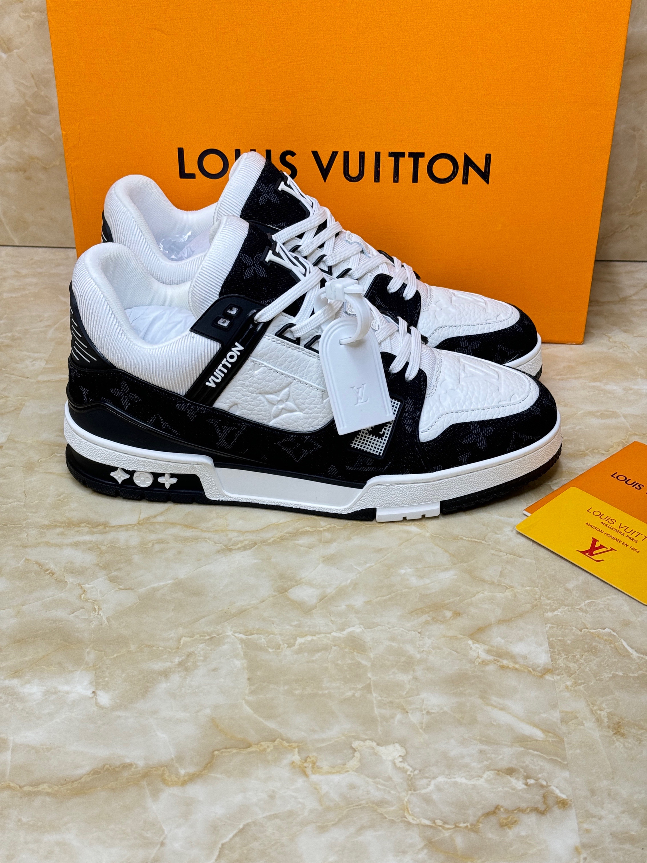 Louis Vuitton LV Trainer sneaker in black and white calf leather and Monogram denim. image 1