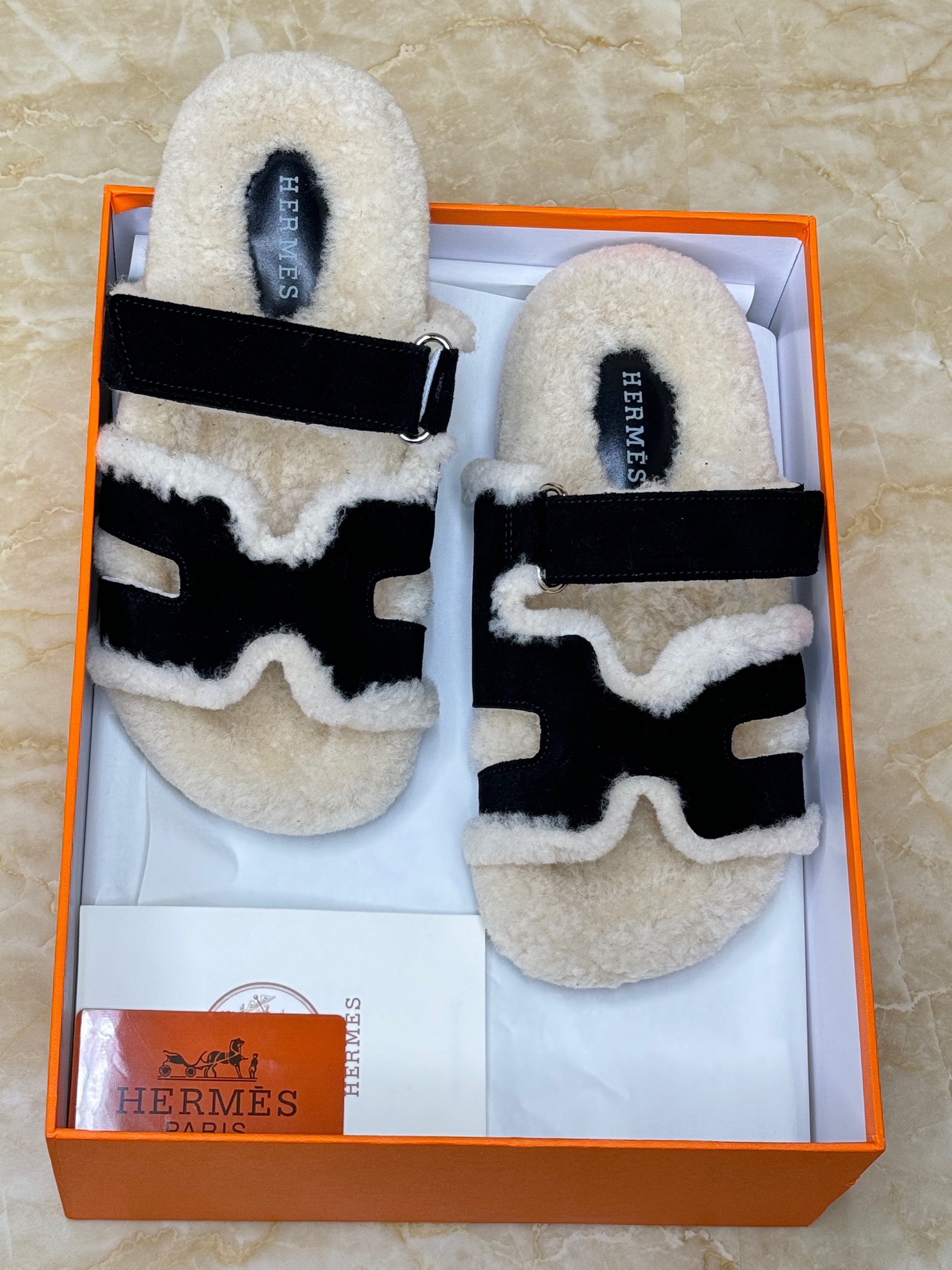 Herm?s Chypre shearling sandals made of suede goatskin and lined with shearling. image 1