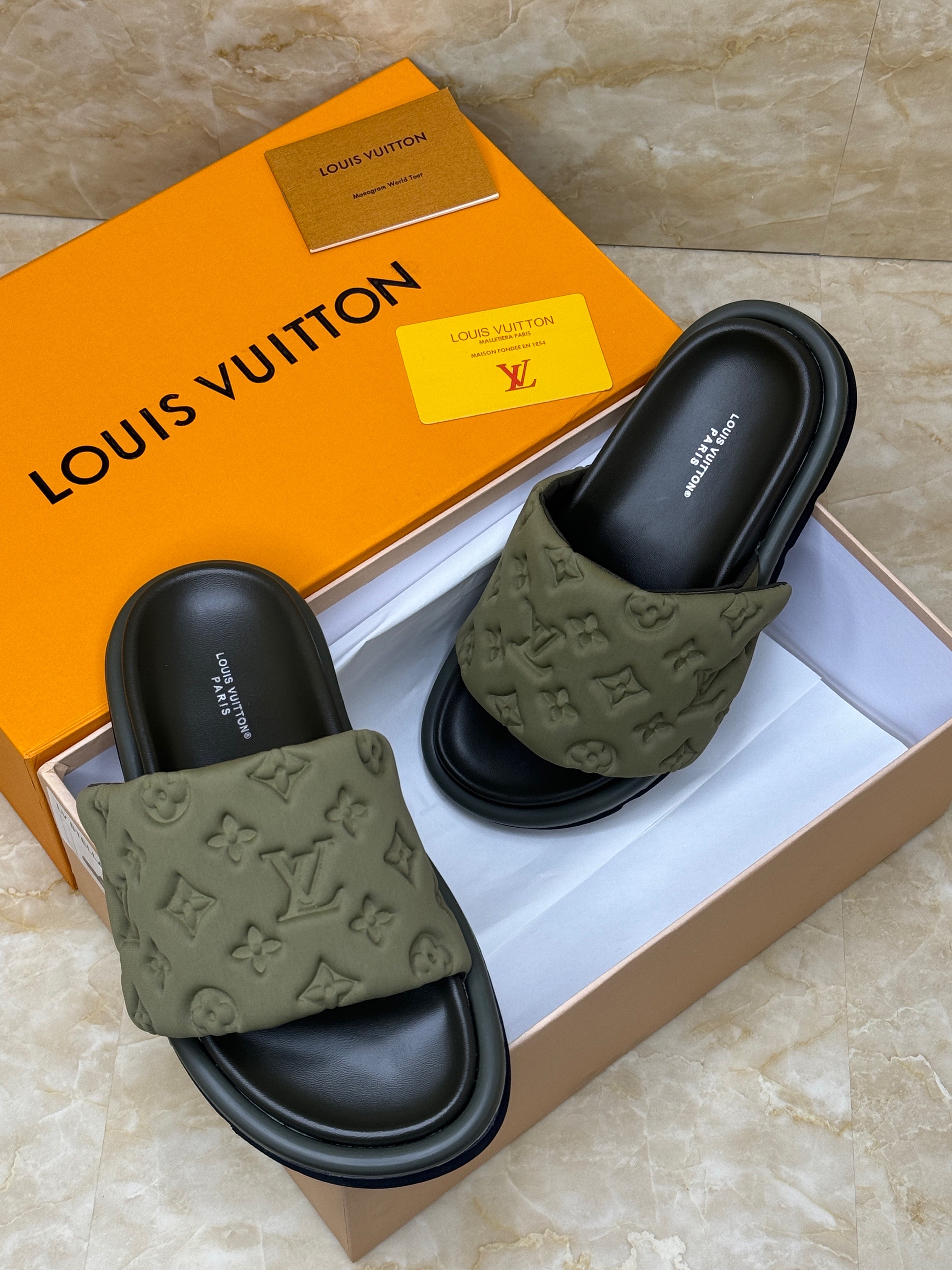Louis Vuitton Pool Pillow Comfort Mules in an olive green color. image 1