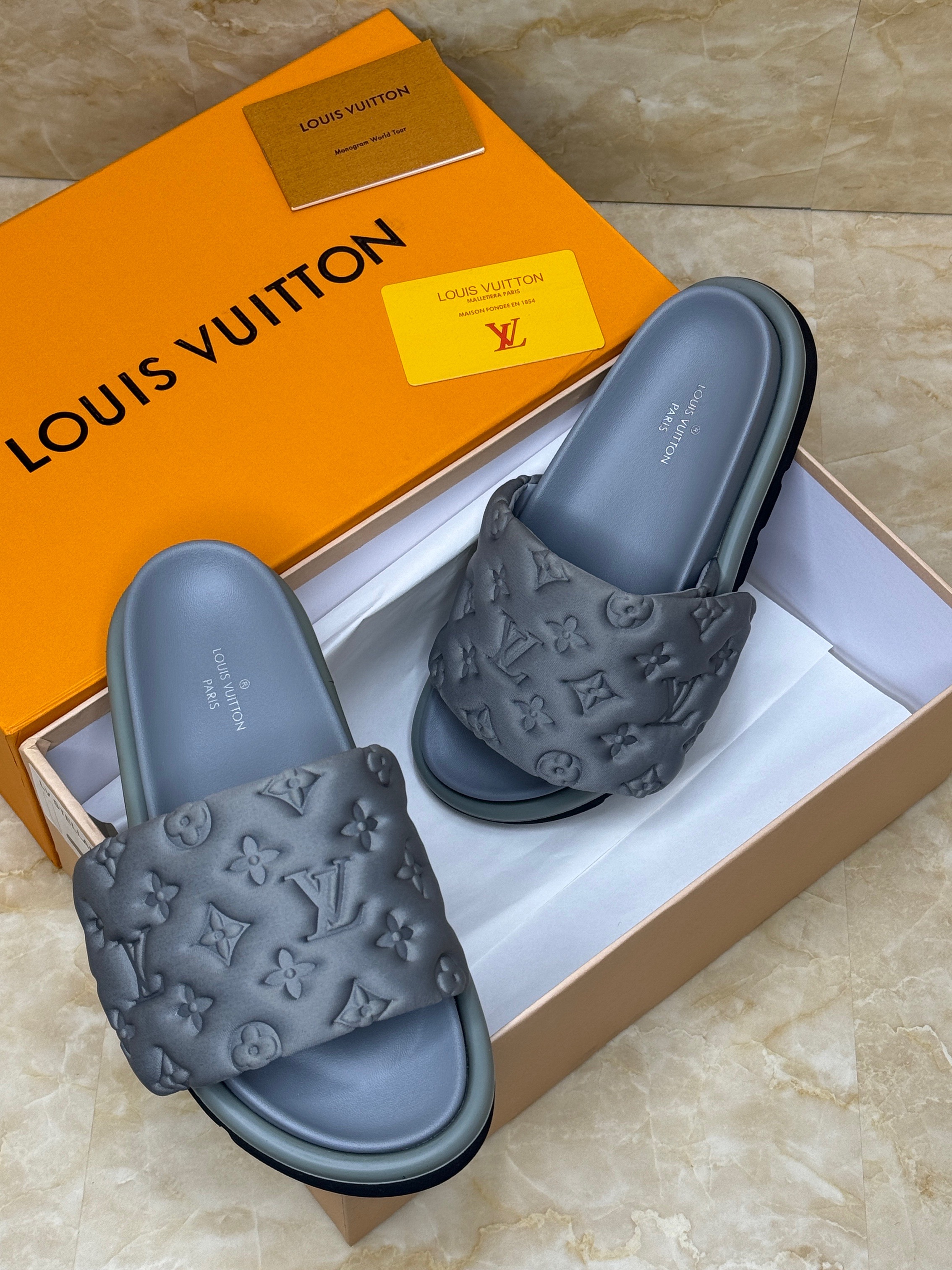 Louis Vuitton Waterfront mules in black monogram rubber. image 1