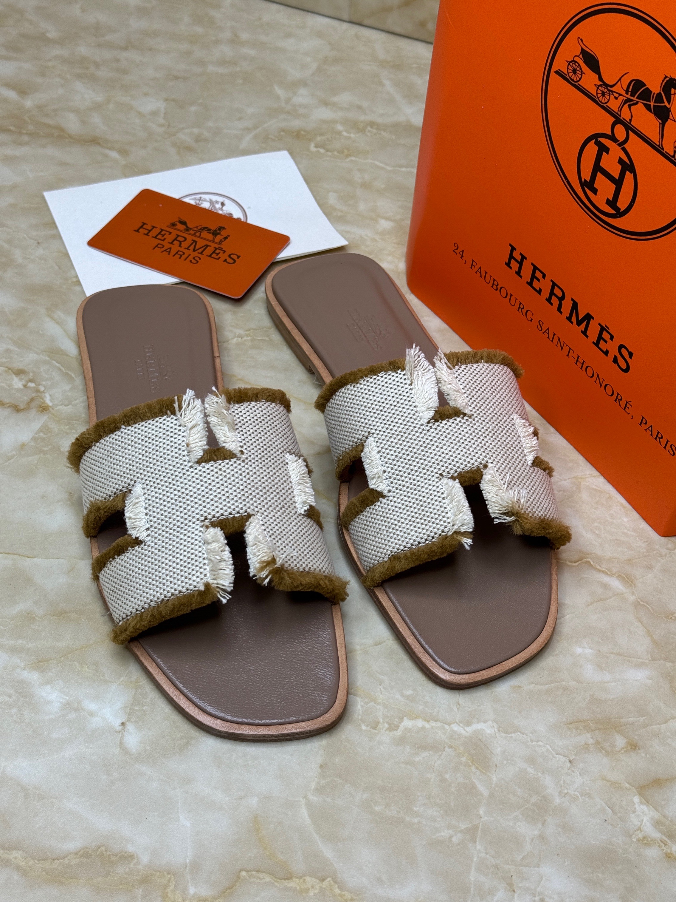 Herm?s Oran sandals with a fringed linen H-cutout strap and a leather sole. image 1