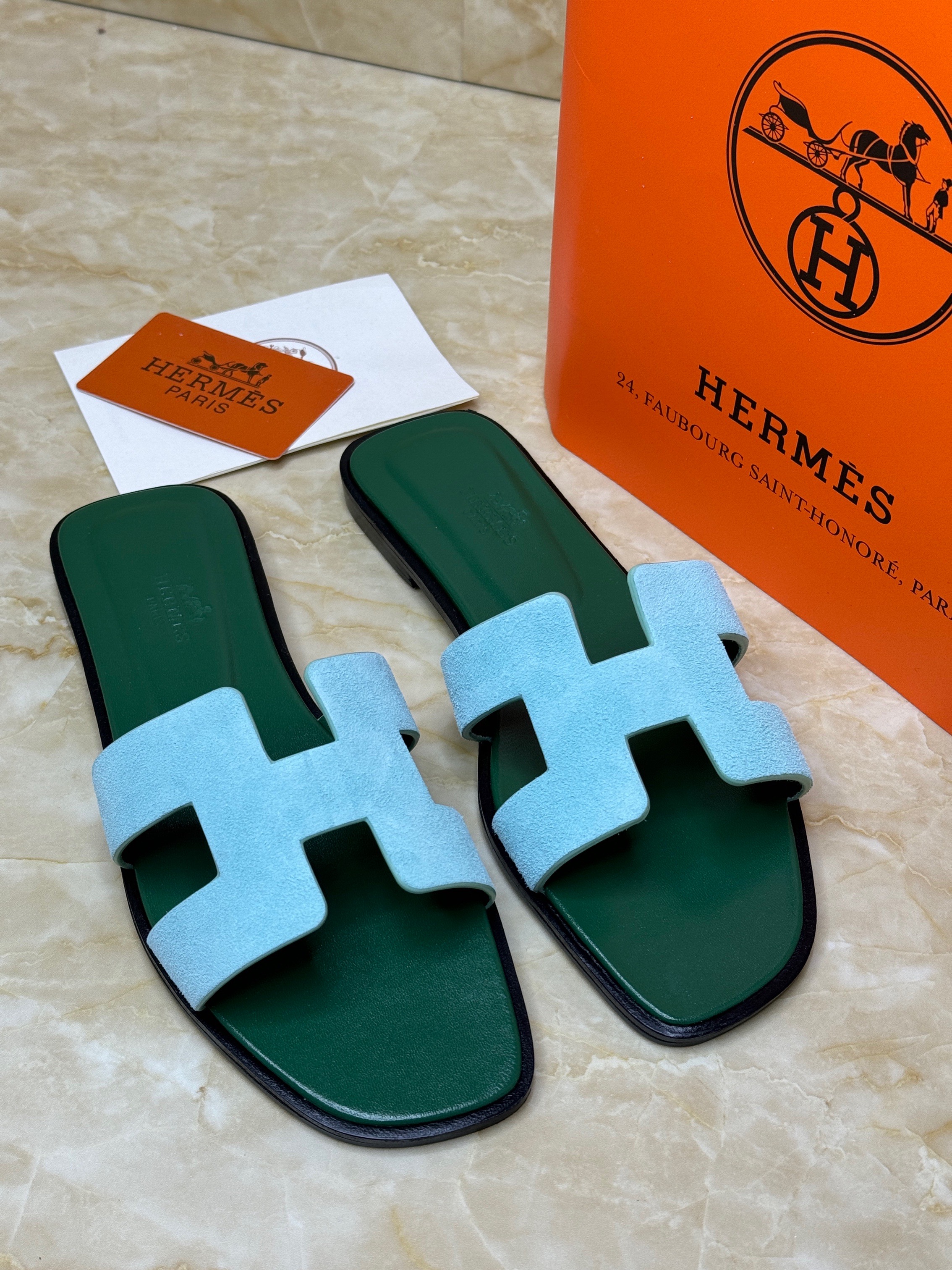 Herm?s Oran sandals, featuring the brand's signature "H" cut-out design. image 1