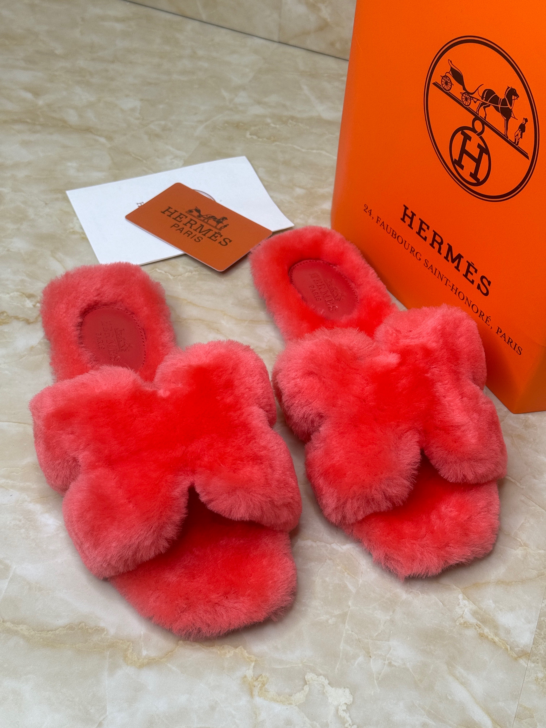 Herm?s Oran sandals in fur woolskin, likely in the color Rose Du Desert. image 1