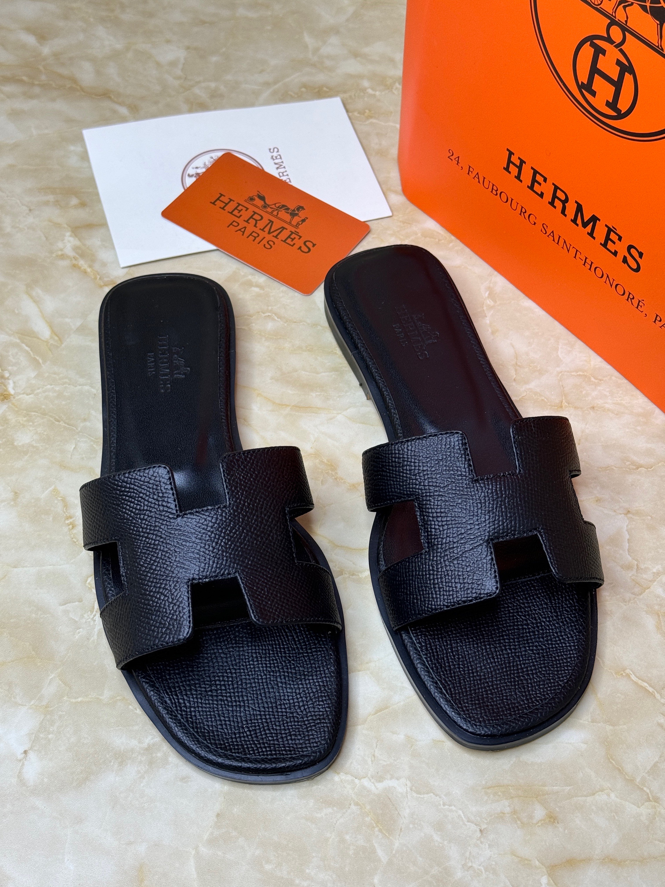 Herm?s Oran sandals crafted from calfskin leather with an iconic "H" cut-out design. image 1