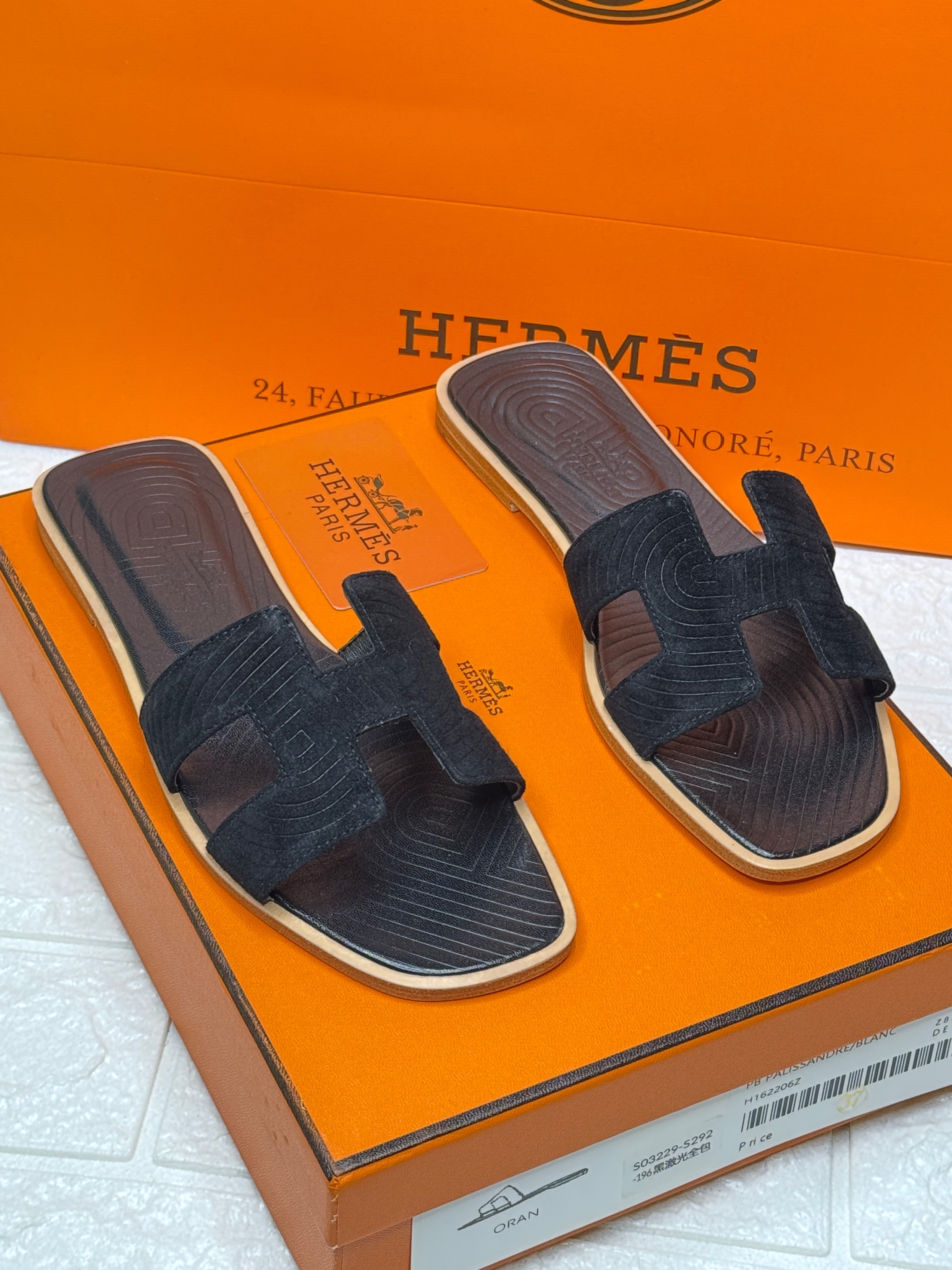 Herm?s Oran sandals in black leather. image 1